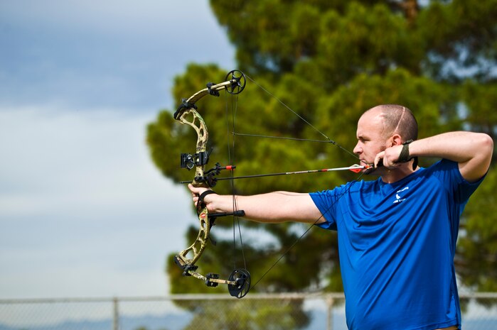 Warrior athlete Kevin Taylor, practices archery during the Air Force Wounded Warrior Team Trials April 9, 2014, at Nellis Air Force Base, Nev. Athletes participating in the trials are service members with upper-body, lower-body, and spinal cord injuries serious illnesses, traumatic brain injuries, visual impairment, and post-traumatic stress disorder. (U.S. Air Force photo by Senior Airman Christopher Tam)

