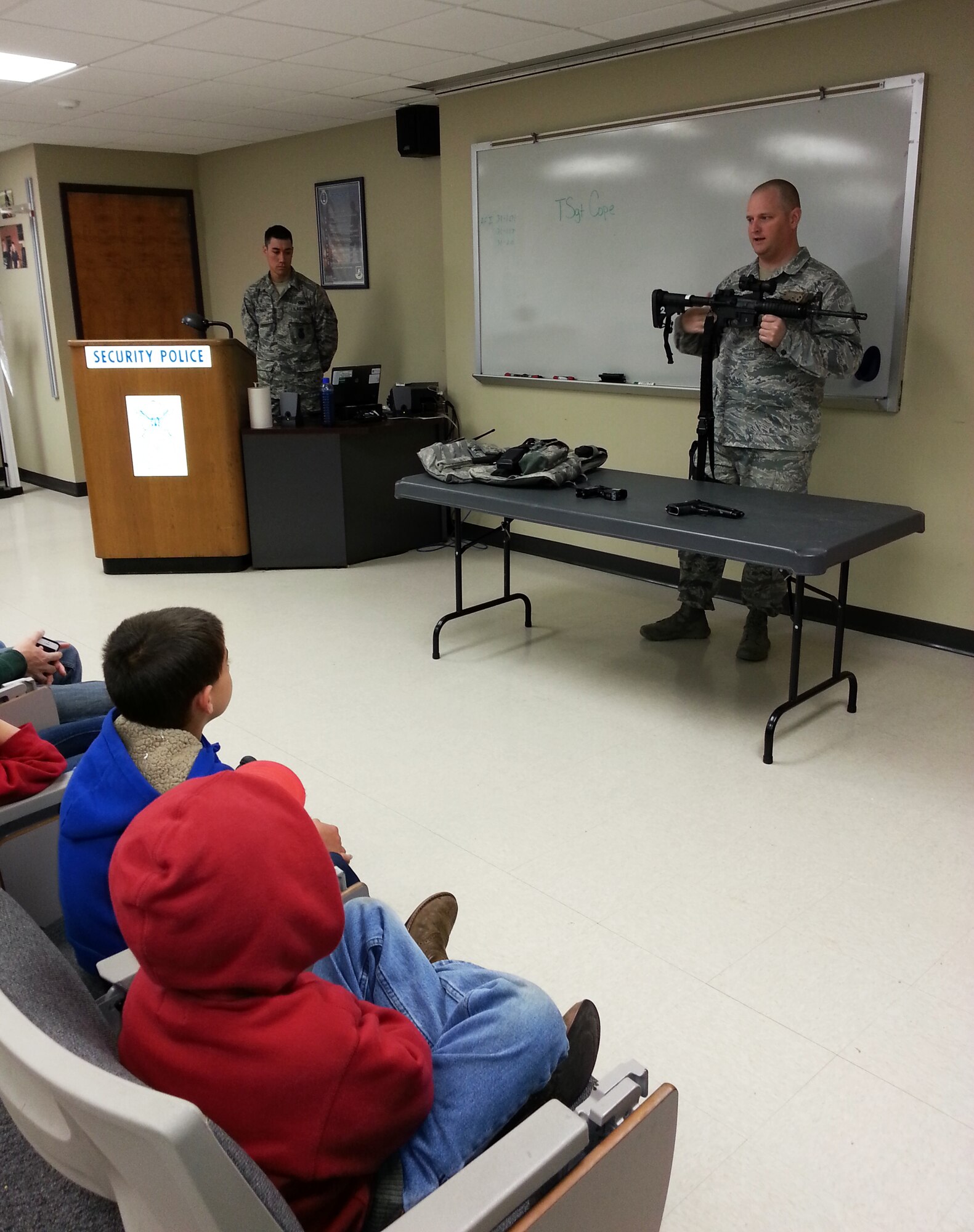 Tech Sgt. Joseph Cope of the 188th Security Forces Squadron briefs Believers Home School Group on the equipment the Flying Razorback Defenders use during a tour of the 188th Fighter Wing April 9, 2014. Approximately 115 members of the group also toured the 188th’s Fire Emergency Services Flight and A-10 static display. The group also received a mission briefing on the 188th’s on-going conversion from fighters to an Intelligence, Reconnaissance and Surveillance, space-focused targeting and remotely piloted aircraft mission.  (U.S. Air National Guard photo by Maj. Heath Allen/Released)