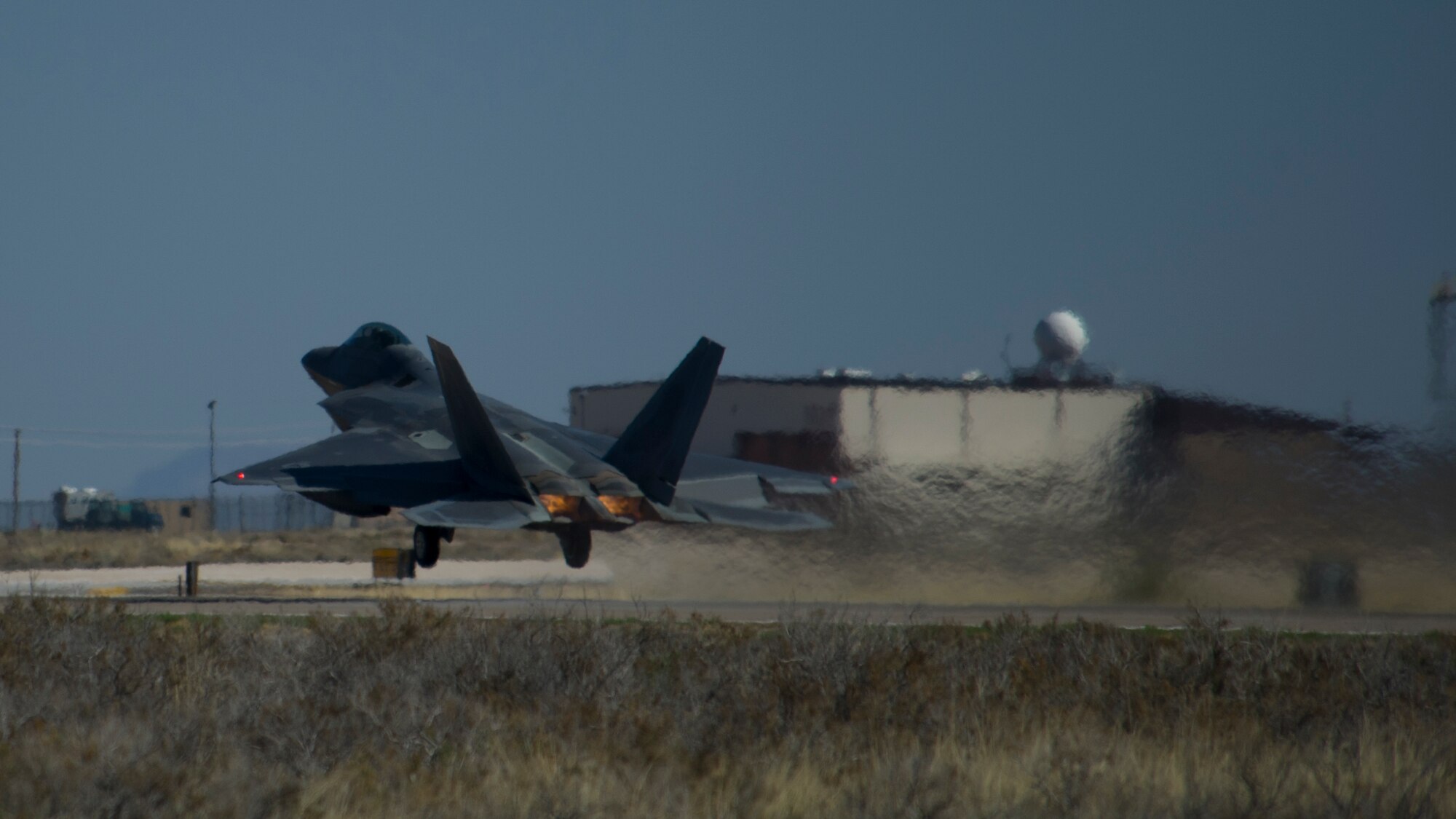 One of the last four F-22 Raptors from the 7th Fighter Squadron prepares to depart for Tyndall Air Force Base, Fla., at Holloman Air Force Base, N.M., April 8. Holloman bids farewell to the F-22 Raptors as the 7th Fighter Squadron transitions its mission to Tyndall to continue training for air superiority. (U.S. Air Force photo by Airman 1st Class Aaron Montoya / Released)