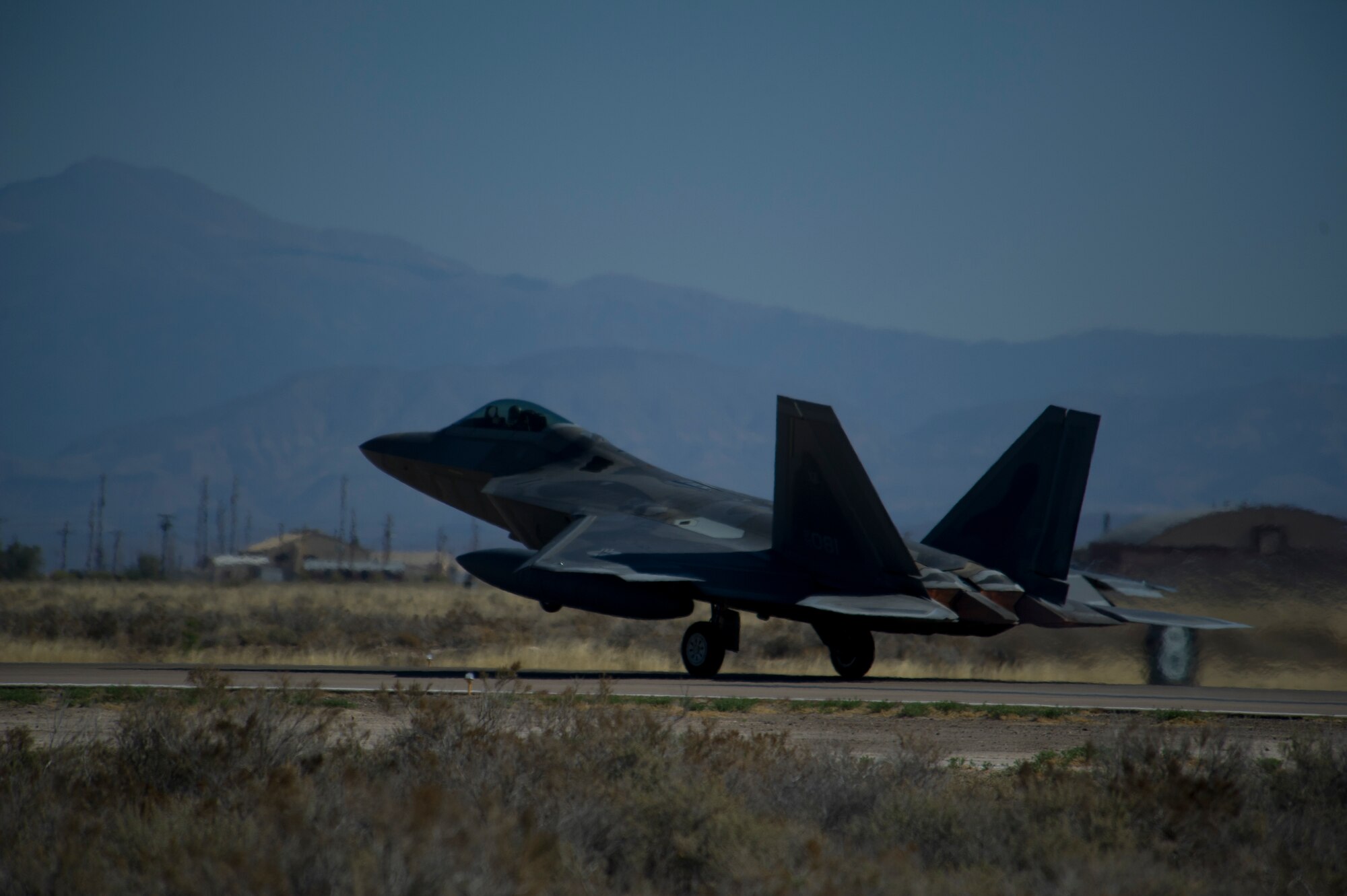 One of the last four F-22 Raptors from the 7th Fighter Squadron prepares to depart for Tyndall Air Force Base, Fla., at Holloman Air Force Base, N.M., April 8. Holloman bids farewell to the F-22 Raptors as the 7th Fighter Squadron transitions its mission to Tyndall to continue training for air superiority. (U.S. Air Force photo by Airman 1st Class Aaron Montoya / Released)