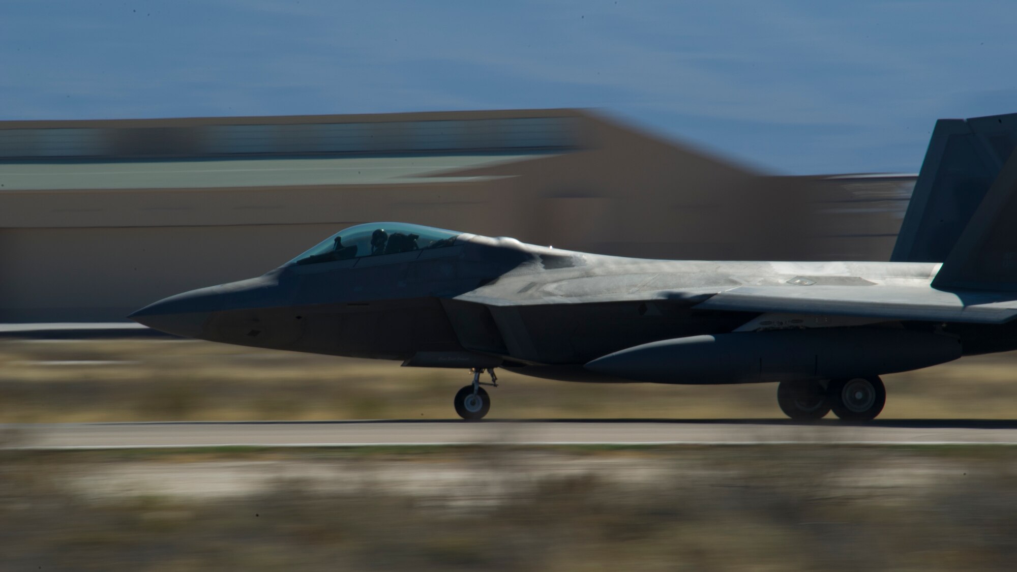 One of the last four F-22 Raptors from the 7th Fighter Squadron prepares to depart for Tyndall Air Force Base, Fla., at Holloman Air Force Base, N.M., April 8. Holloman bids farewell to the F-22 Raptors as the 7th Fighter Squadron transitions its mission to Tyndall to continue training for air superiority. (U.S. Air Force photo by Airman 1st Class Aaron Montoya / Released)