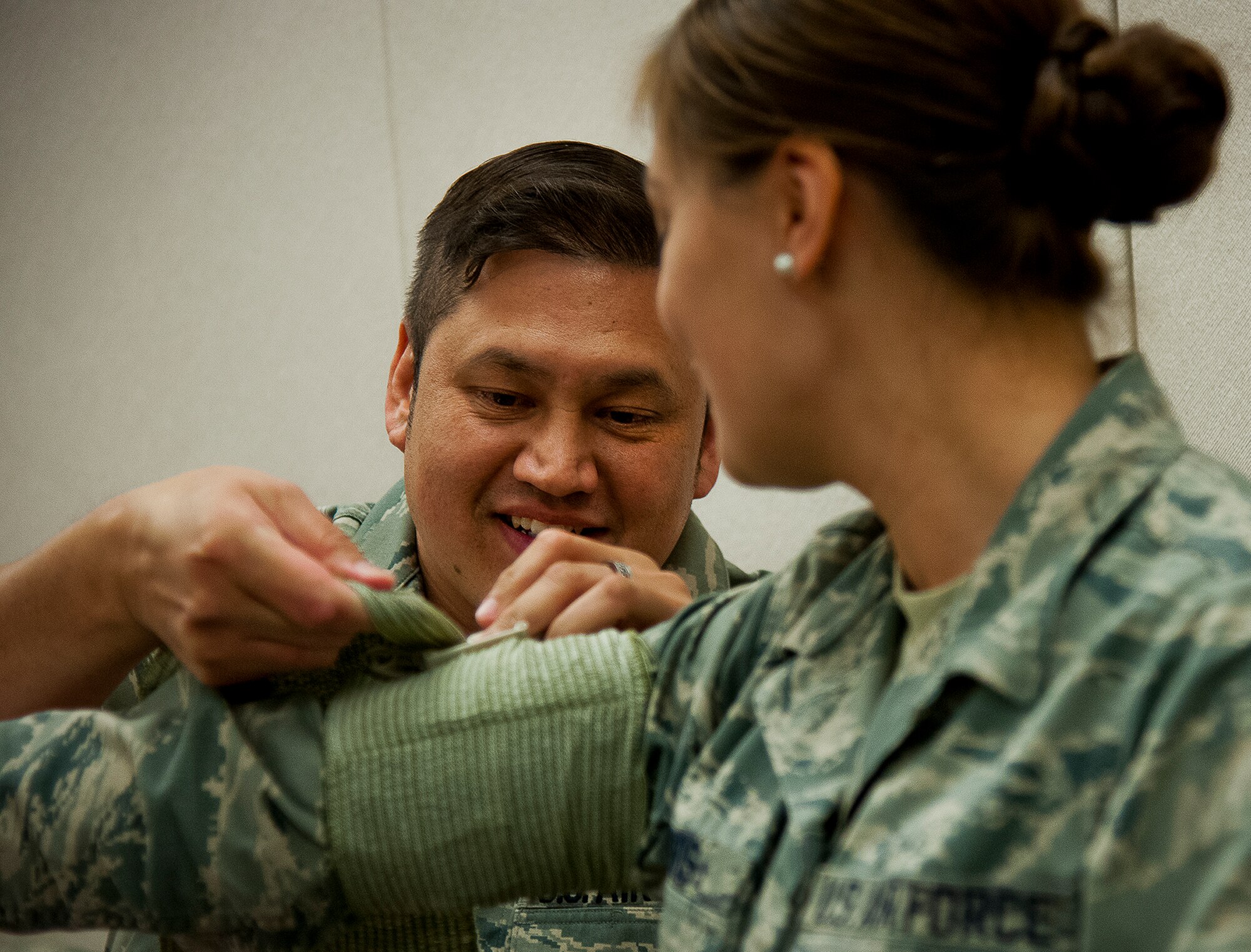 An Airman applies a field dressing during a Self-Aid and Buddy Care instructor course at Duke Field April 4.  The course was offered during the 919th’s annual four-day Super UTA that focuses heavily on ancillary training.  (U.S. Air Force photo/Tech. Sgt. Samuel King Jr.)