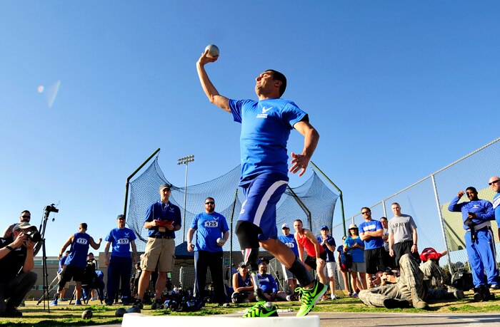 Wounded Warrior, (Ret) Senior Airman Scott Palomino performs the standing shot put at the Air Force Wounded Warrior Team Trials, April 8, 2014 at Rancho High School, Las Vegas.  During the trials wounded warriors competed in swimming, basketball, volleyball, track and field events, cycling, archery and shooting competitions. (U.S. Air Force photo by Senior Master Sgt. Cecilio Ricardo)