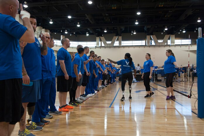 Warrior athletes count off to split into groups for seated volleyball practice at the Air Force Wounded Warrior Team Trials at the Warrior Fitness Center, April 7, 2014, at Nellis Air Force Base, Nev. The athlete roster will include service members with upper-body, lower-body, spinal cord injuries, serious illnesses, traumatic brain injuries, visual impairment, and post-traumatic stress disorder. (U.S. Air Force photo by Airman 1st Class Thomas Spangler)