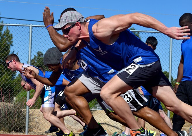 Wounded Warriors leave the starting blocks at the start of the men's 100-meter race during the Air Force Wounded Warrior Team Trials, April 8, 2014 at Rancho High School, Las Vegas. The athletes will be participating in adaptive athletic reconditioning, which are athletic activities that are modified to meet the abilities of injured or ill individuals. (U.S. Air Force photo by Staff Sgt. Nadine Barclay)

