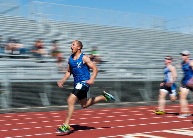 Warrior athlete Charles Ming, races past the competition in the men’s 100 meter final during the track and field portion of the Wounded Warrior trials, April 8, 2014, at Rancho High School, Las Vegas, Nev.  In addition to track and field, warrior athletes will also compete in seated volleyball, swimming, air rifle and pistol shooting, and wheelchair basketball. (U.S. Air Force photo by Airman 1st Class Thomas Spangler)