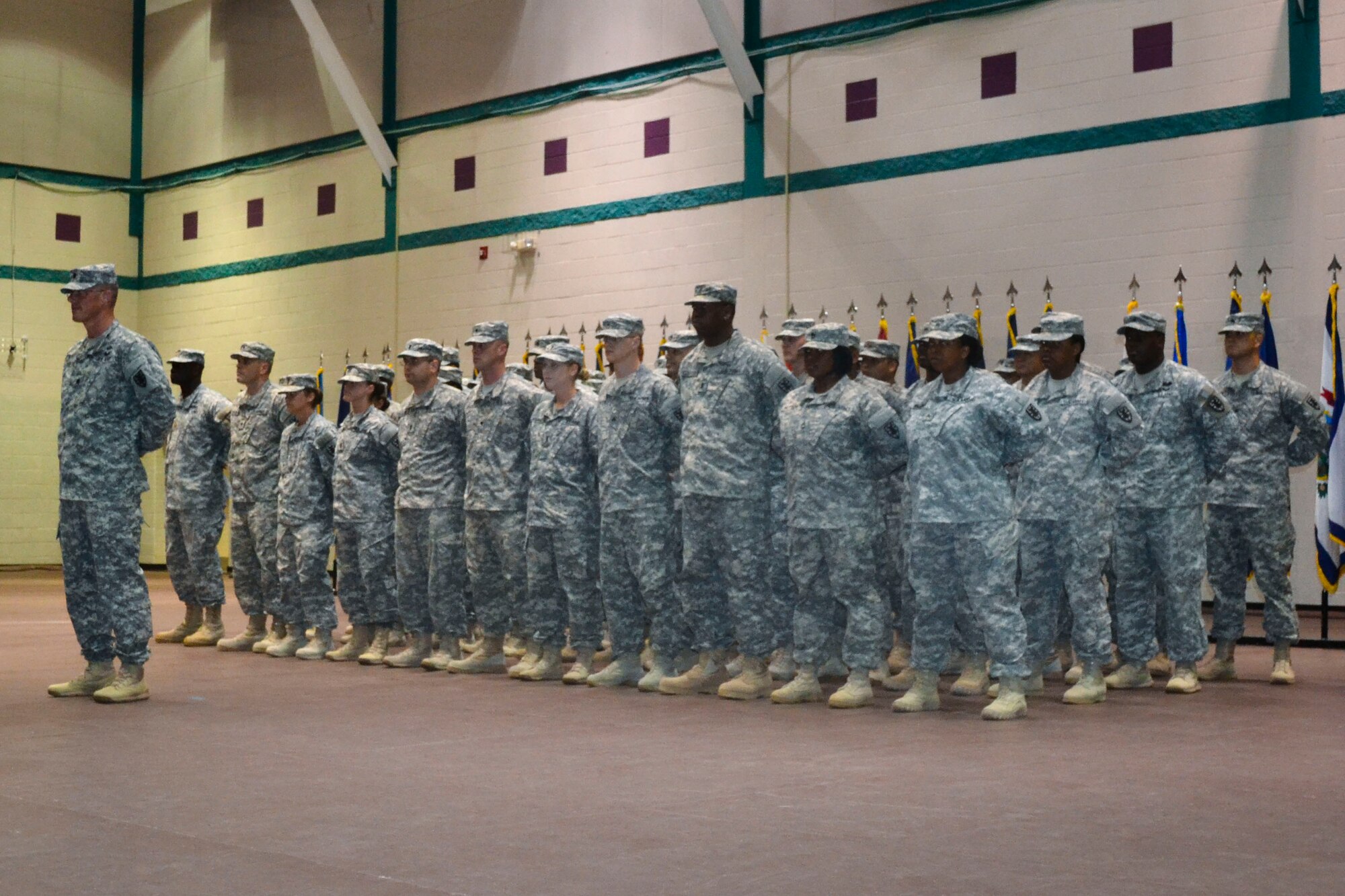 U.S. Army Soldiers from the 53rd Transportation Battalion, 7th Transportation Brigade (Expeditionary) stand in formation during a redeployment ceremony at Fort Eustis, Va., April 7, 2014. The 53rd Trans. Bn. established a new process during their tour in Kuwait that improved coordination of assets and approval time by 40 percent. (U.S. Army photo by Sgt. Eveangeline Ellis/Released)