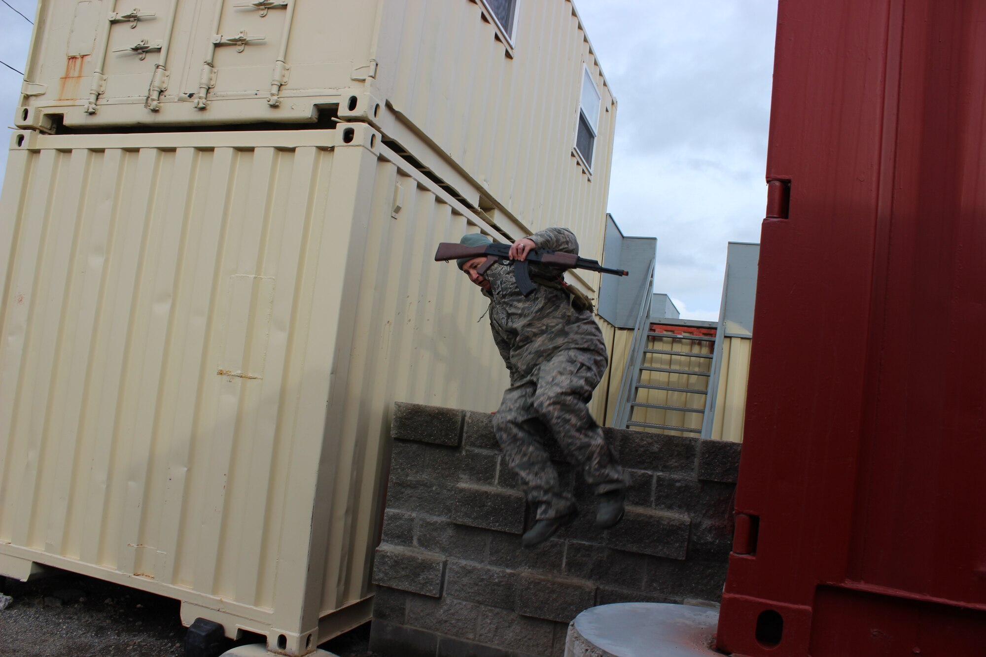 Tech. Sgt. Eric Pulkinen, 368th Recruiting Squadron recruiter, jumps over a wall during Survival, Evasion, Resistance and Escape training at Fairchild Air Force Base, Wash., March 5.  Members of the 368th RCS learned SERE techniques during squadron quarterly training in order to help them advise recruits who are interested in the SERE career field. (U.S. Air Force photo/Master Sgt. Mike Brown)