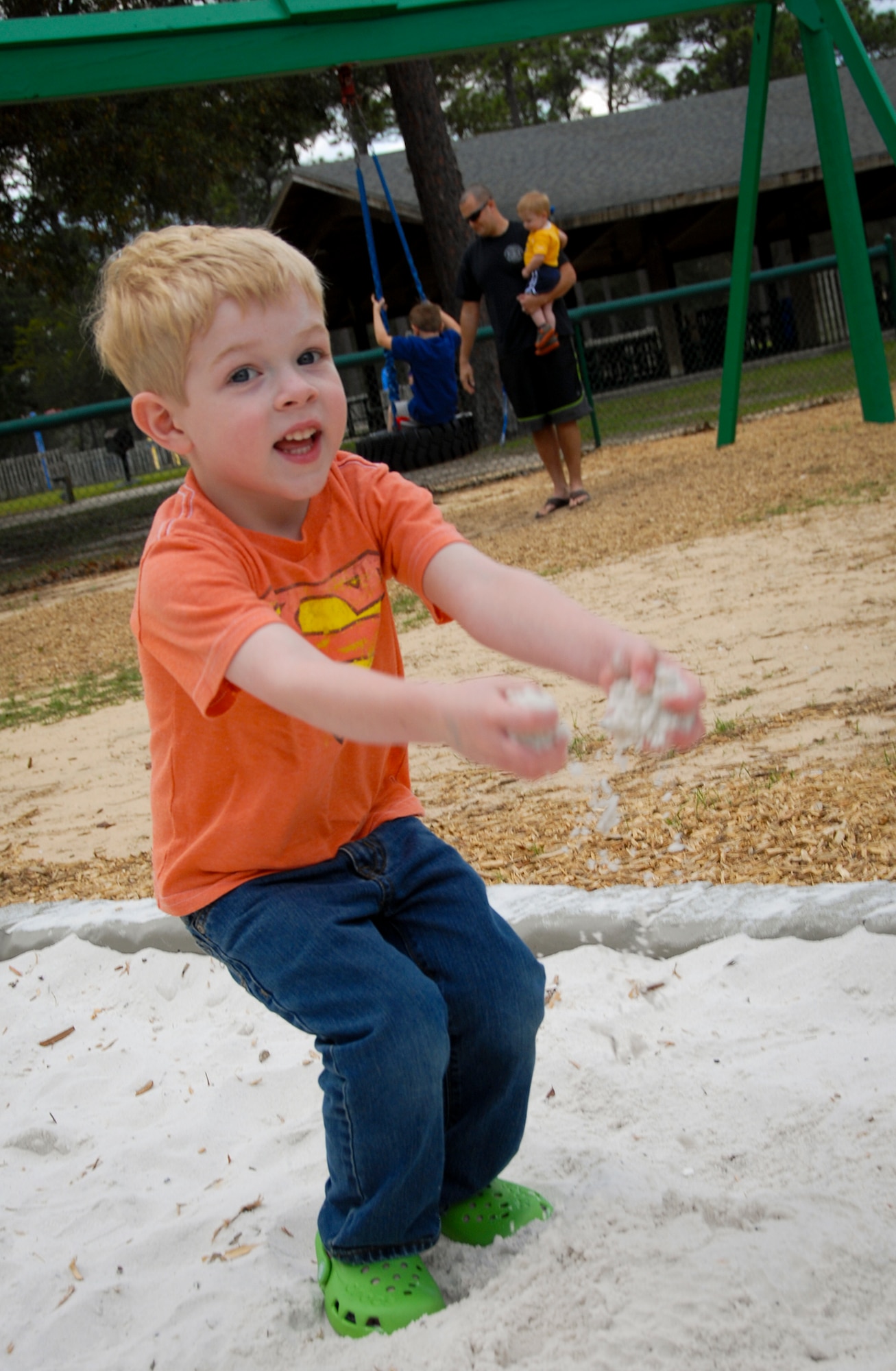 Evan Roos, son of Maj. Gary Roos, of the Air Force Research Laboratory, plays in the sandbox during a visit to Unity Park.  The park reopened to the Eglin Air Force base community and their families April 1, following four months of renovations.  (U.S. Air Force photo/Kevin Gaddie)