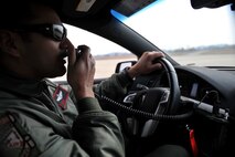 Maj. David (last name withheld due to operational security constraints), 5th Reconnaissance Squadron U-2 Dragon Lady pilot, acts as a mobile officer and speaks to Maj. Ricardo (last name withheld due to operational security constraints), 5th RS director of operations and U-2 pilot, after Ricardo lands at the end of his mission at Osan Air Base, Republic of Korea, March 8, 2014. Mobile officers, or mobiles, are other U-2 pilots that act as the “eyes” of the pilot in a “chase car” that follows behind the aircraft while it taxis, takes off, and lands to feed pertinent information directly to the pilot. (U.S. Air Force photo/Senior Airman Siuta B. Ika)