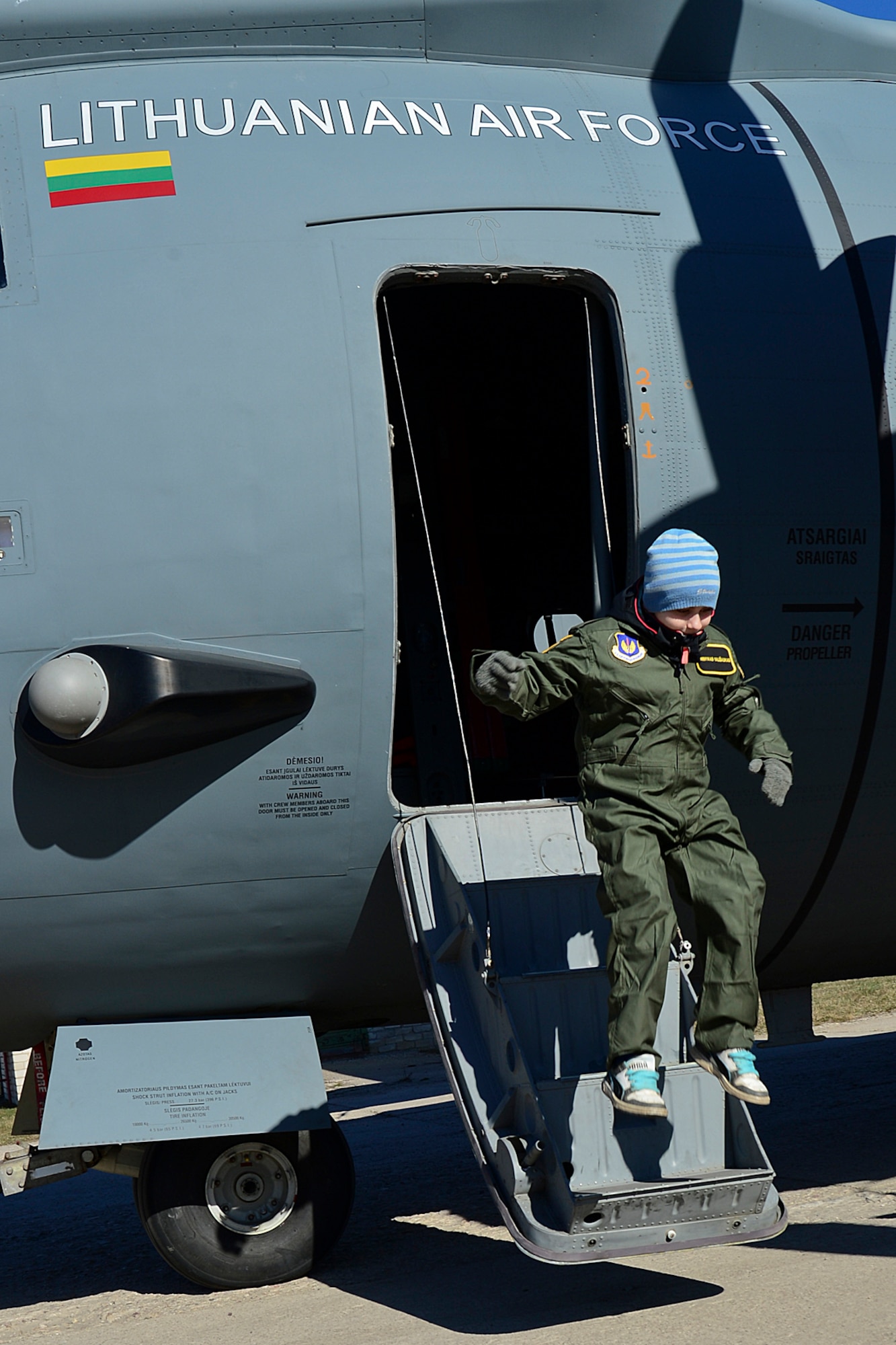 Dominykas Vališaukas jumps out of a Lithuanian air force C-27J Spartan during the ‘Pilot for a Day’ event at Šiauliai Air Base, Lithuania, April 4, 2014. ‘Pilot for a Day’ gives local children with serious illnesses and conditions a day away from routine hospital visits to see the U.S. Air Force mission up close. (U.S. Air Force photo by Airman 1st Class Dana J. Butler/Released)