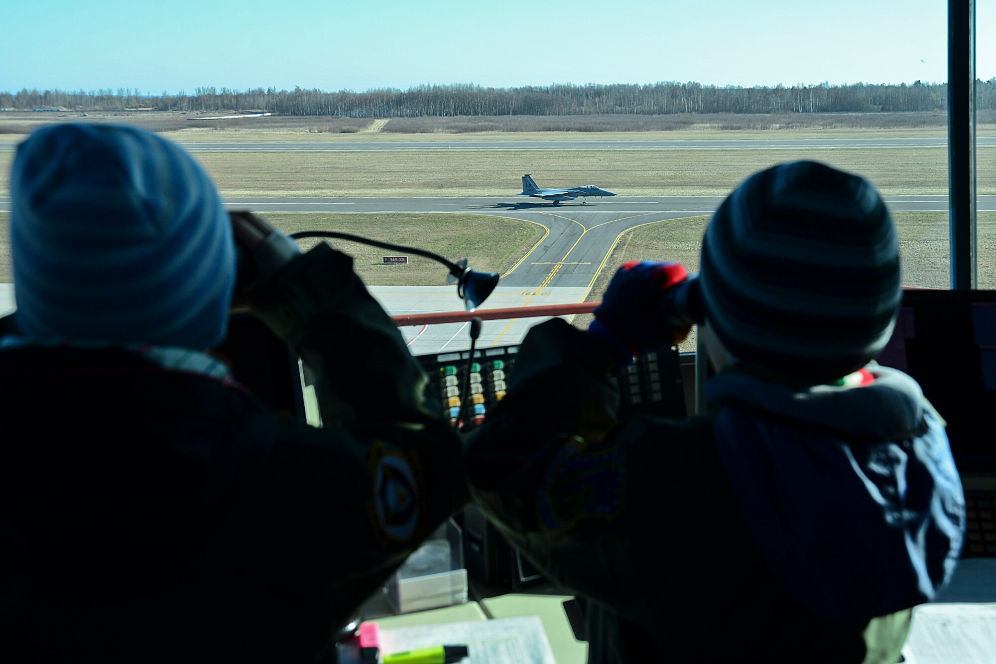 Dominykas Vališaukas and Deimantas Grybas watch from the control tower as an F-15C Eagle takes off during the ‘Pilot for the Day’ event at Šiauliai Air Base, Lithuania, April 4, 2014. ‘Pilot for a Day’ gives local children with serious illnesses and conditions a day away from routine hospital visits to see the U.S. Air Force mission up close. (U.S. Air Force photo by Airman 1st Class Dana J. Butler/Released)