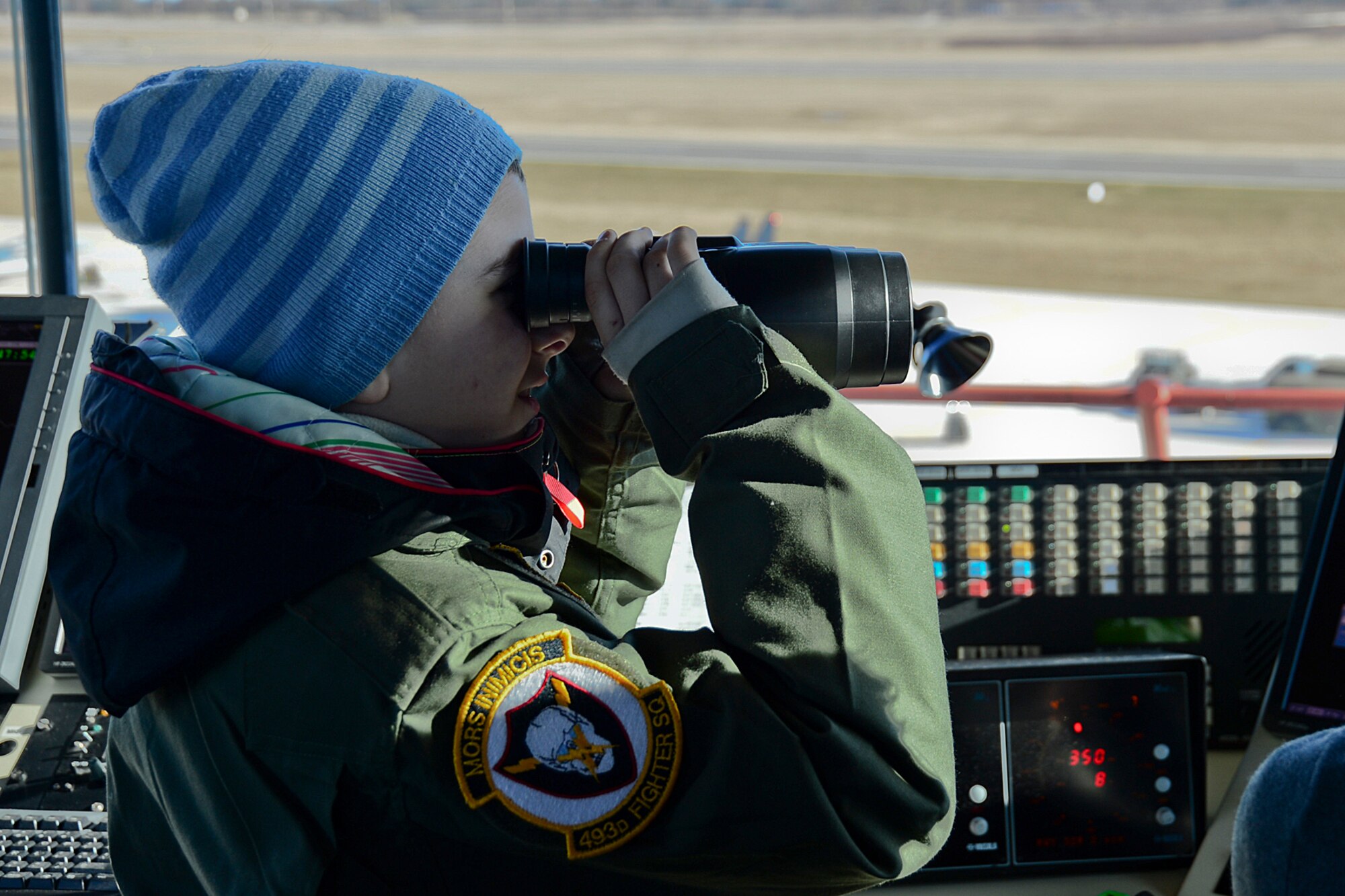 Dominykas Vališaukas watches from the control tower as an F-15C Eagle takes off during the ‘Pilot for the Day’ event at Šiauliai Air Base, Lithuania, April 4, 2014. ‘Pilot for a Day’ gives local children with serious illnesses and conditions a day away from routine hospital visits to see the U.S. Air Force mission up close. (U.S. Air Force photo by Airman 1st Class Dana J. Butler/Released)
