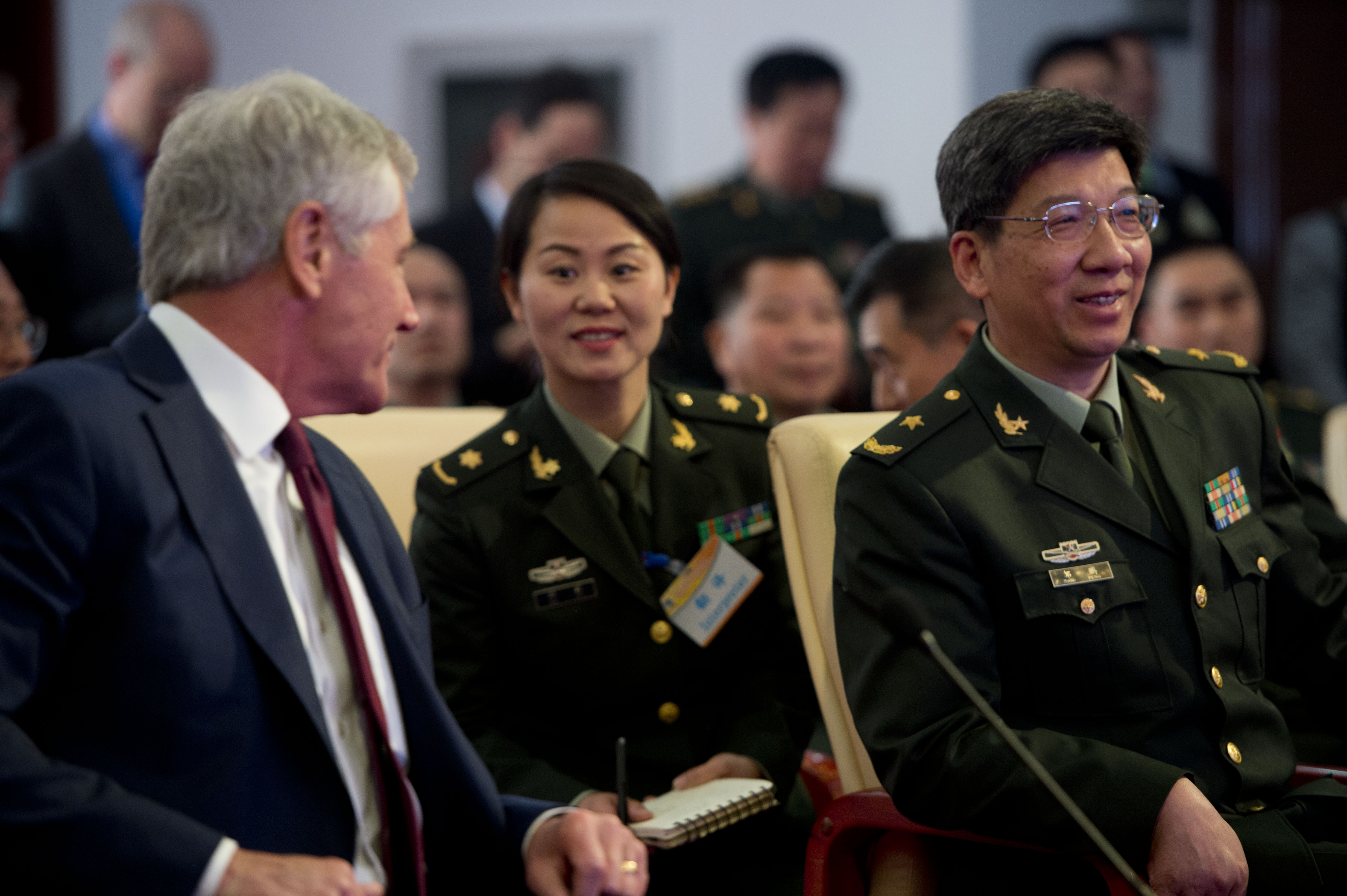 U.S. Defense Secretary Chuck Hagel speaks with a Chinese military