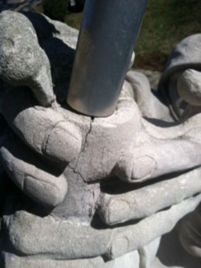 Cracks line a hand of the Iwo Jima monument aboard Marine Corps Base Quantico on March 31, 2014. The damage was caused by weathering. Plans for repairs are being made. 