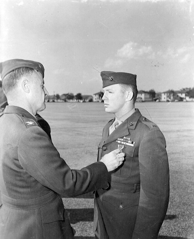 In an undated photograph, Richard Ferry, 15-year Marine veteran, receives a second purple heart for wounds received during the Korean conflict, at Marine Corps Recruit Depot Parris Island. Ferry will be running two of the Marine Corps Marathon events. 