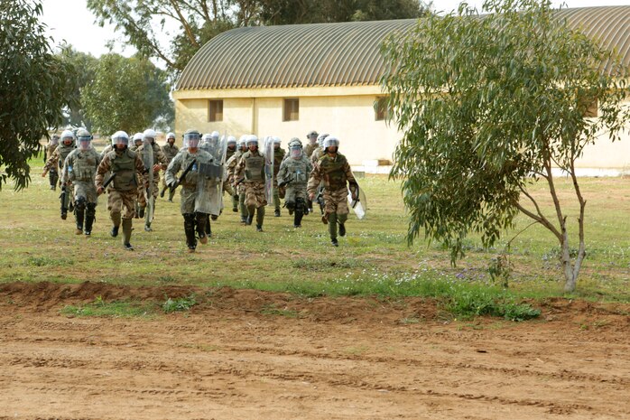 A force of Moroccan riot-control soldiers and U.S. Marine, Army and Air Force military police officers rush to control a simulated situation of civil disorder during Exercise African Lion 14, Tifnit, Morocco. Military police officers from the U.S. Marines, Army and Air Force, along with Royal Moroccan soldiers specializing in riot-control, found common ground as enforcers of the law during African Lion 14, an annually-scheduled, multilateral training engagement that is hosted by the Kingdom of Morocco. One of the largest of its kind on the continent, the engagement shows the commitment of the participating nations to military friendships, strategic partnerships and regional and global security.