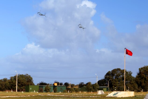 Two MV-22B Ospreys from Special-Purpose Marine Air-Ground Task Force Crisis Response fly by a Moroccan flag during a rapid-response demonstration to multinational observers of African Lion 14. Exercise African Lion is U.S. Africa Command’s flagship program in Northern Africa to build partner-nation capacity and interoperability. The African Lion 14 Observer Program was built to showcase the exercise to potential participants, setting the foundation for more robust military engagements in future iterations. The U.S. Marine Corps Forces Europe and Africa-led engagement is one of the biggest of its kind on the continent and, during African Lion 14, hosted a multilateral event that included military observers from Mauritania, Egypt, Tunisia, Turkey, Great Britain, Belgium, the Netherlands, Portugal, Germany, Spain, Senegal, Poland, Turkey, Italy, and France.

