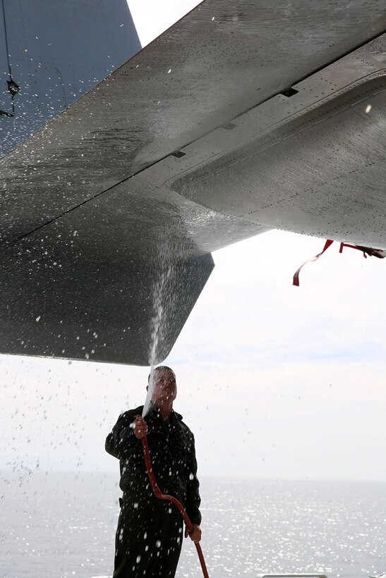 Lance Cpl. Blake Hammack, a flightline mechanic with Marine Medium Tiltrotor Squadron 163 (Reinforced), 11th Marine Expeditionary Unit, and a St. Charles, Miss. native, cleans an MV-22B Osprey aboard the USS Makin Island during Amphibious Squadron Marine Expeditionary Unit Integration Training (PMINT) off the coast of San Diego, Calif. April 8. PMINT is the first at-sea event in the 11th MEU’s predeployment training program where the unit will conduct live training operations alongside the Makin Island Amphibious Ready Group. (U.S. Marine Corps photo by Sgt. Melissa Wenger/Released)