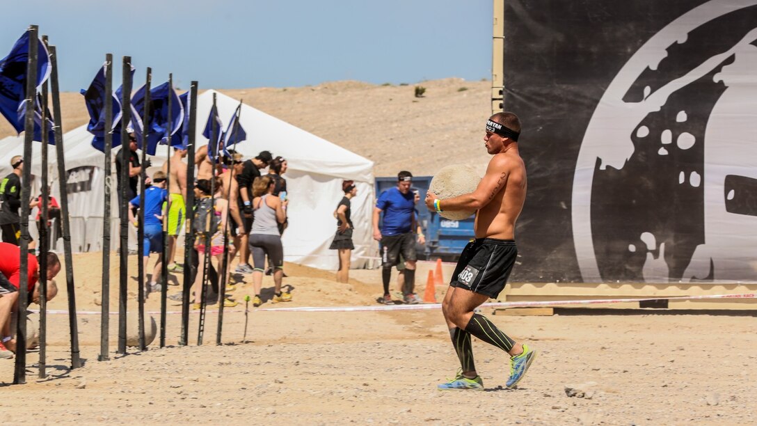 Spencer C. Garvin, a Marine with the 15th Marine Expeditionary Unit, hurries to complete his obstacle during a Spartan Race in Las Vegas, April 5, 2014. Garvin, 26, is from Elko, Nev. (U.S. Marine Corps photo by Cpl. Emmanuel Ramos/Released)