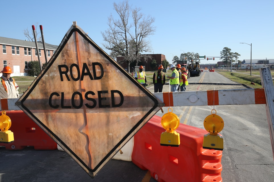 Employees with the Public Works Department at Marine Corps Air Station Cherry Point, N.C., refurbish part of 5th Avenue here, March 11, 2014. 