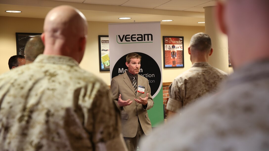 Marines at Marine Corps Air Station Cherry Point, N.C.,  listen to a representative from Veeam give a presentation on Veeam products April 3, 2014 at the Two Rivers Theater.