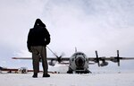 Chief Master Sgt. Bill Nolin conducts pre-flight checks on an LC-130 Hercules, Nov. 26, 2007, at the annual sea ice runway near McMurdo Station, Antarctica during Operation Deep Freeze. Ski-equipped LC-130s, crews and support personnel from the New York Air National Guard’s 109th Airlift Wing are supporting a mission in the arctic in a closely watched exercise.