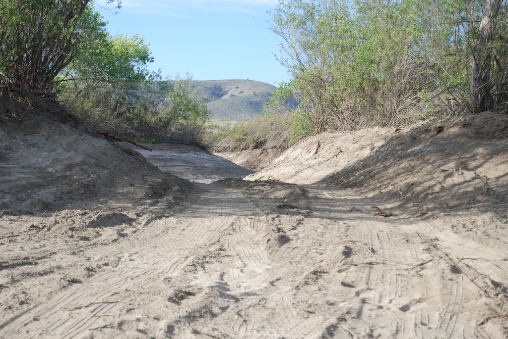 The mitigaton project next to Whelan Lake in Oceanside will provide seasonal flooding to reestablish a wetland environment. This section of one of the completed ribbon channels adjacent to the San Luis Rey River will allow water during rain events to flow around several islands that were left in place to provide habitat for endangered species. 