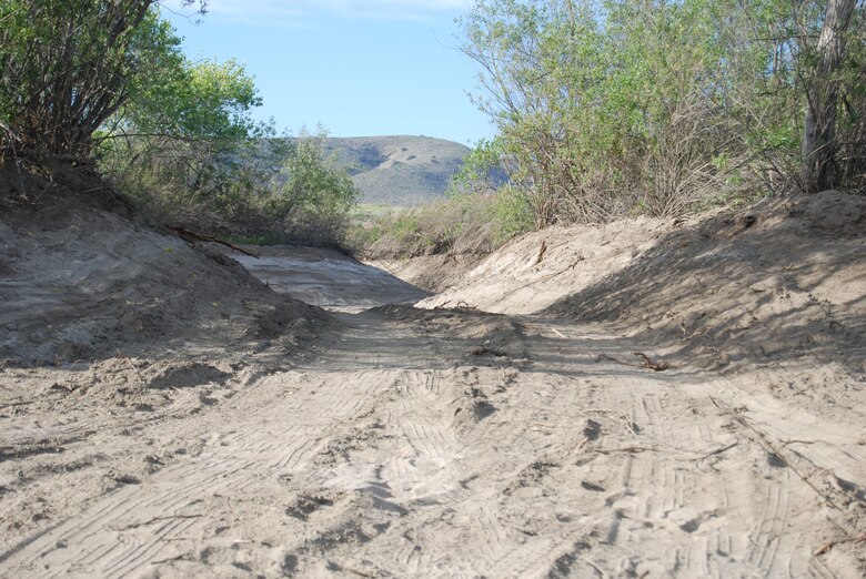 The mitigaton project next to Whelan Lake in Oceanside will provide seasonal flooding to reestablish a wetland environment. This section of one of the completed ribbon channels adjacent to the San Luis Rey River will allow water during rain events to flow around several islands that were left in place to provide habitat for endangered species. 