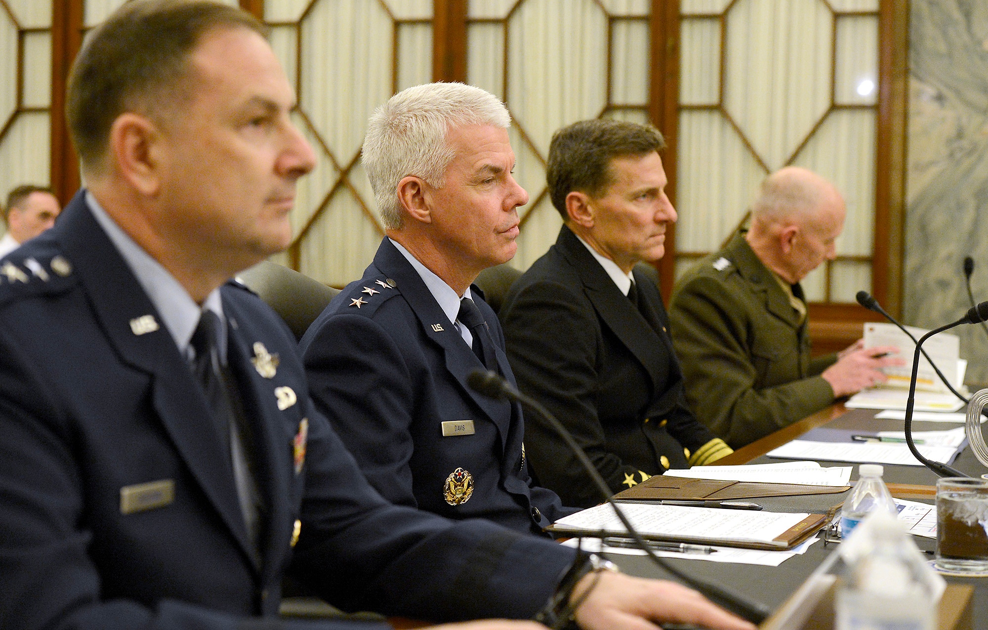 Lt. Gen. Charles R. Davis, second from left, testifies April 8, 2014, before the Senate Subcommittee on Air and Land in Washington, D.C.  Witnesses from other services at the hearing included Lt. Gen. Christopher C. Bogden, U.S. Air Force Program Executive officer, F-35 Lightning II Joint Program Office; Vice Adm. Paul A. Grosklags, Principal Military Deputy to the Assistant Secretary of the Navy for Research, Development and Acquisition; and Lt. Gen. Robert E. Schmidle Jr., Deputy Commandant of the Marine Corps for Aviation. Davis is the Military Deputy to the Assistant Secretary of the Air Force for Acquisition. (U.S. Air Force photo/Scott M. Ash)