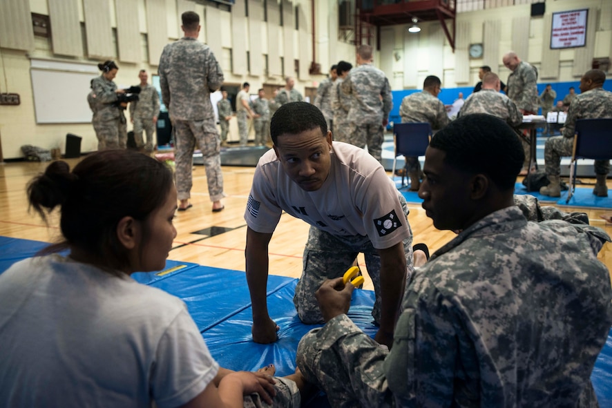 Soldiers discuss strategy before an upcoming combatatives match March 19, 2014, at Osan Air Base, Republic of Korea. The tournament in March was a qualifying tournament for the larger combatives matchup peninsula wide. (U.S. Air Force photo by Staff Sgt. Jake Barreiro)