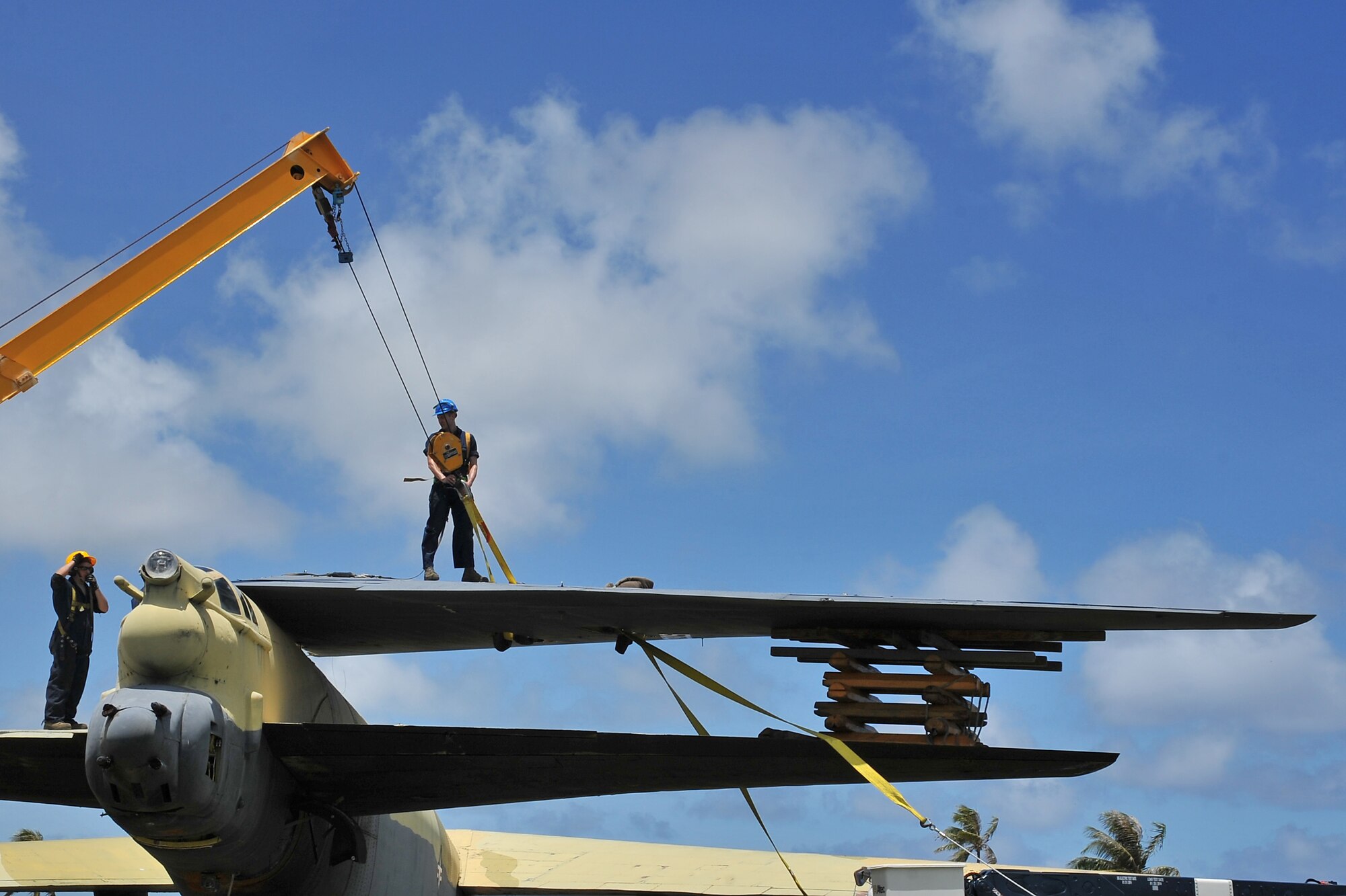Airmen from the 36th Maintenance Squadron dismantle the vertical tail of the “Old-100” static display B-52D Stratofortress at Arc Light Memorial Park on Andersen Air Force Base, Guam, March 22, 2014. The aircraft is being removed due to irreparable deterioration.  The vertical tail section is being preserved and will play a key part in the redesigned memorial site at the park when the project is completed. (U.S. Air Force photo by Staff Sgt. Melissa B. White/Released)