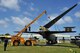 Airmen from the 36th Maintenance Squadron dismantle the vertical tail section of the “Old-100” static display B-52D Stratofortress at Arc Light Memorial Park on Andersen Air Force Base, Guam, March 22, 2014. The aircraft is being removed due to irreparable damage from weather. The vertical tail section is being preserved and will be part of redesigned memorial when the project is completed. (U.S. Air Force photo by Staff Sgt. Melissa B. White/Released)