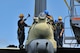 Airmen from the 36th Maintenance Squadron prepare to dismantle the vertical tail section of the “Old-100” static display B-52D Stratofortress at Arc Light Memorial Park on Andersen Air Force Base, Guam, March 22, 2014. The aircraft is being removed due to irreparable deterioration from weather after being on display for more than 30 years. This is the second B-52 at Arc Light Park that has suffered the effects of corrosion on Guam. (U.S. Air Force photo by Staff Sgt. Melissa B. White/Released)