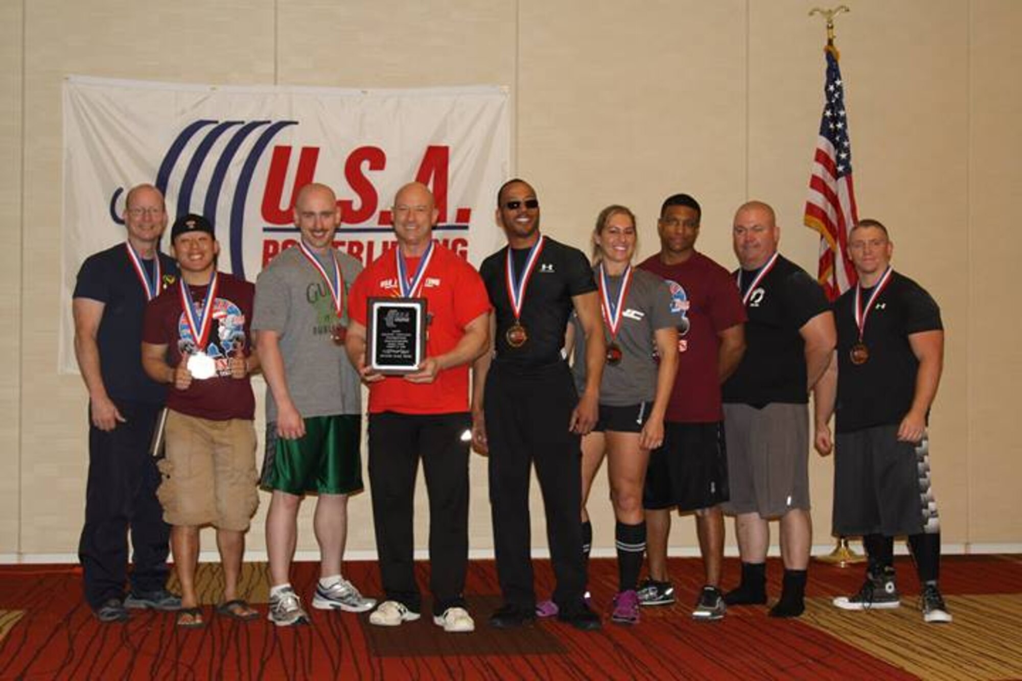 The Air Force team receives the second place award at the 2014 US Military National Powerlifting Championships March 15, 2014, in Killeen, Texas. At the event, Chief Master Sgt. Troy Saunders, Pacific Air Forces vehicle management functional manager, earned 11 gold medals, five military national and four American records. (Courtesy photo)
