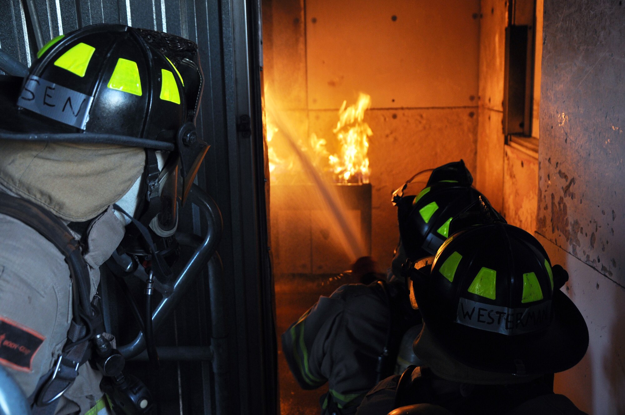 GOODFELLOW AIR FORCE BASE, Texas - Kellen R. Geirke, San Angelo Fire Department recruit, sprays a kitchen fire at the Louis F. Garland Department of Defense Fire Academy here April 8. Geirke and the other SAFD recruits learnt how to fight above and below level fires, which would simulate a basement or second story fire respectively. (U.S. Air Force photo/ Senior Airman Joshua Edwards)