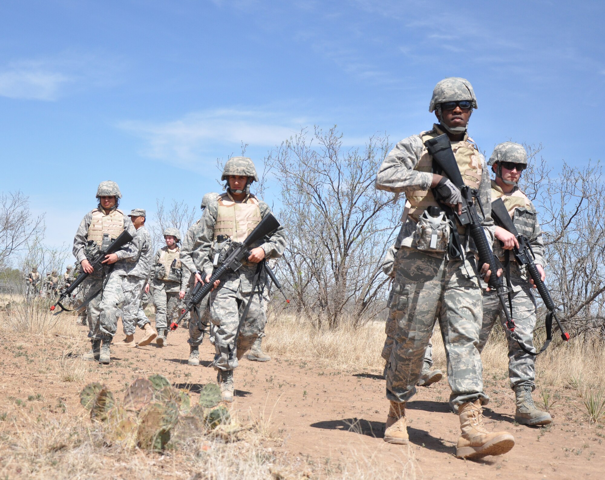 GOODFELLOW AIR FORCE BASE, Texas – Angelo State University Air Force ROTC Detachment 847 students march to a deployed simulation village near Camp Sentinel during a field training exercise here April 4. ASU ROTC used the FTX as a recruitment tool for cadets. (U.S. Air Force photo/ Senior Airman Joshua Edwards))