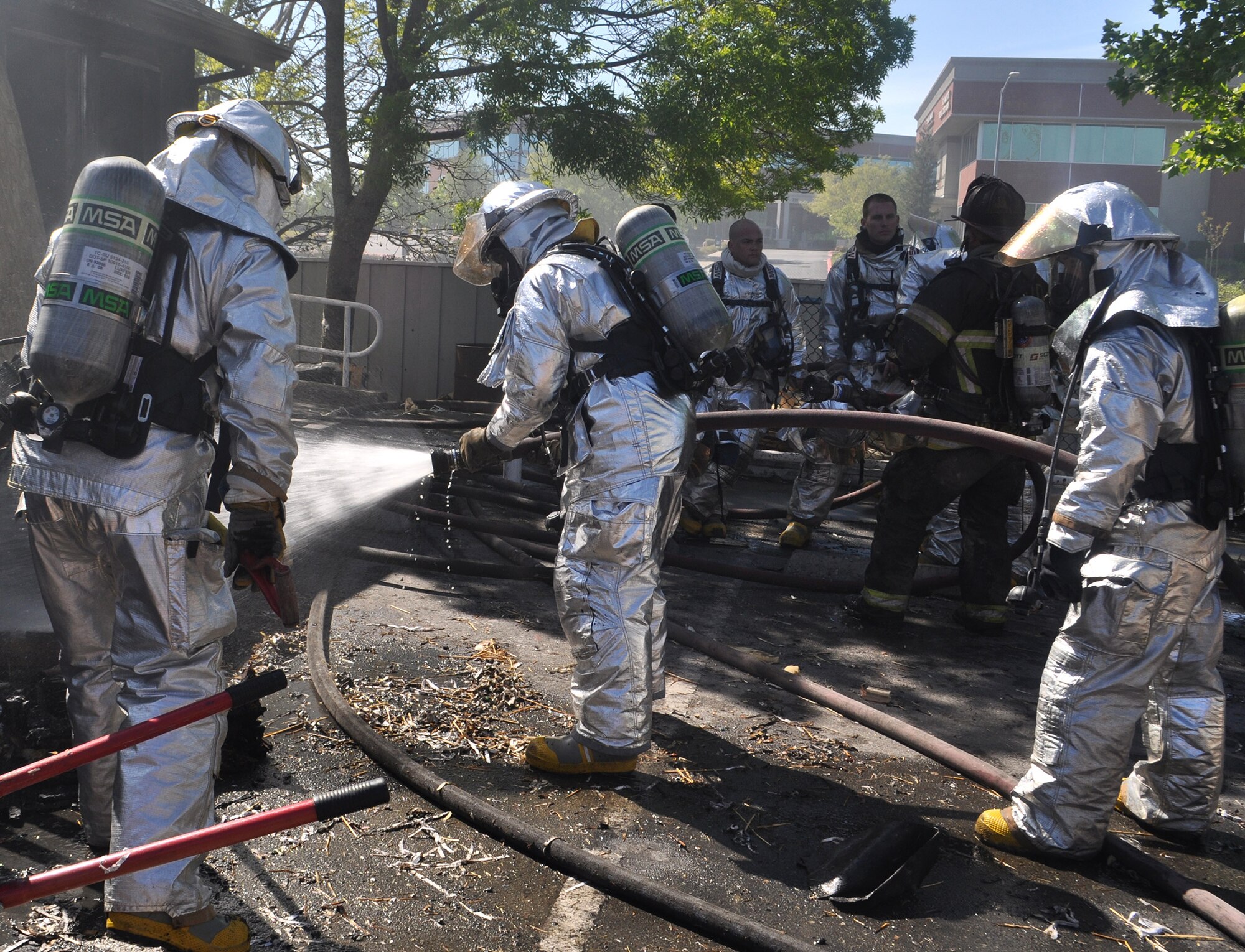 TRAVIS AIR FORCE BASE, Calif. -- Firefighters from Team Travis and Team Beale partnered with firefighters from several local communities, to conduct training at two off-base sites April 5 and 6. Twenty-five Airmen from the 349th and six from the 60th Civil Engineer Squadrons, joined nearly 30 Airmen from the 940th and 9th CES and firefighters from the cities of Vacaville, Fairfield, Dixon, Winters, Suisun City and Benicia, for training to gain additional hands-on experience, and reinforce connections within the neighboring groups. (U.S. Air Force photo / Ellen Hatfield) 