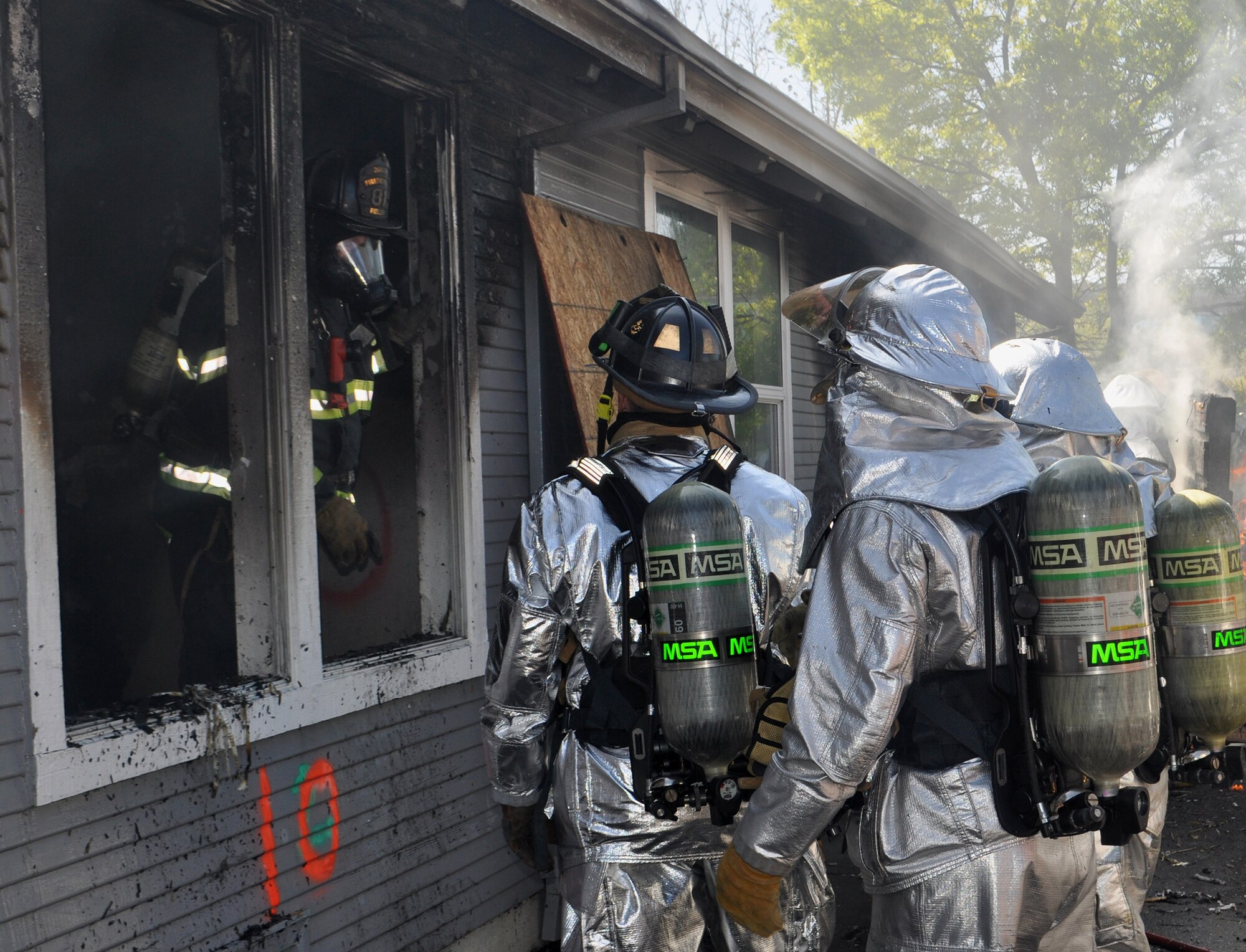 TRAVIS AIR FORCE BASE, Calif. -- Firefighters from Team Travis and Team Beale partnered with firefighters from several local communities, to conduct training at two off-base sites April 5 and 6. Twenty-five Airmen from the 349th and six from the 60th Civil Engineer Squadrons, joined nearly 30 Airmen from the 940th and 9th CES and firefighters from the cities of Vacaville, Fairfield, Dixon, Winters, Suisun City and Benicia, for training to gain additional hands-on experience, and reinforce connections within the neighboring groups. (U.S. Air Force photo / Ellen Hatfield) 