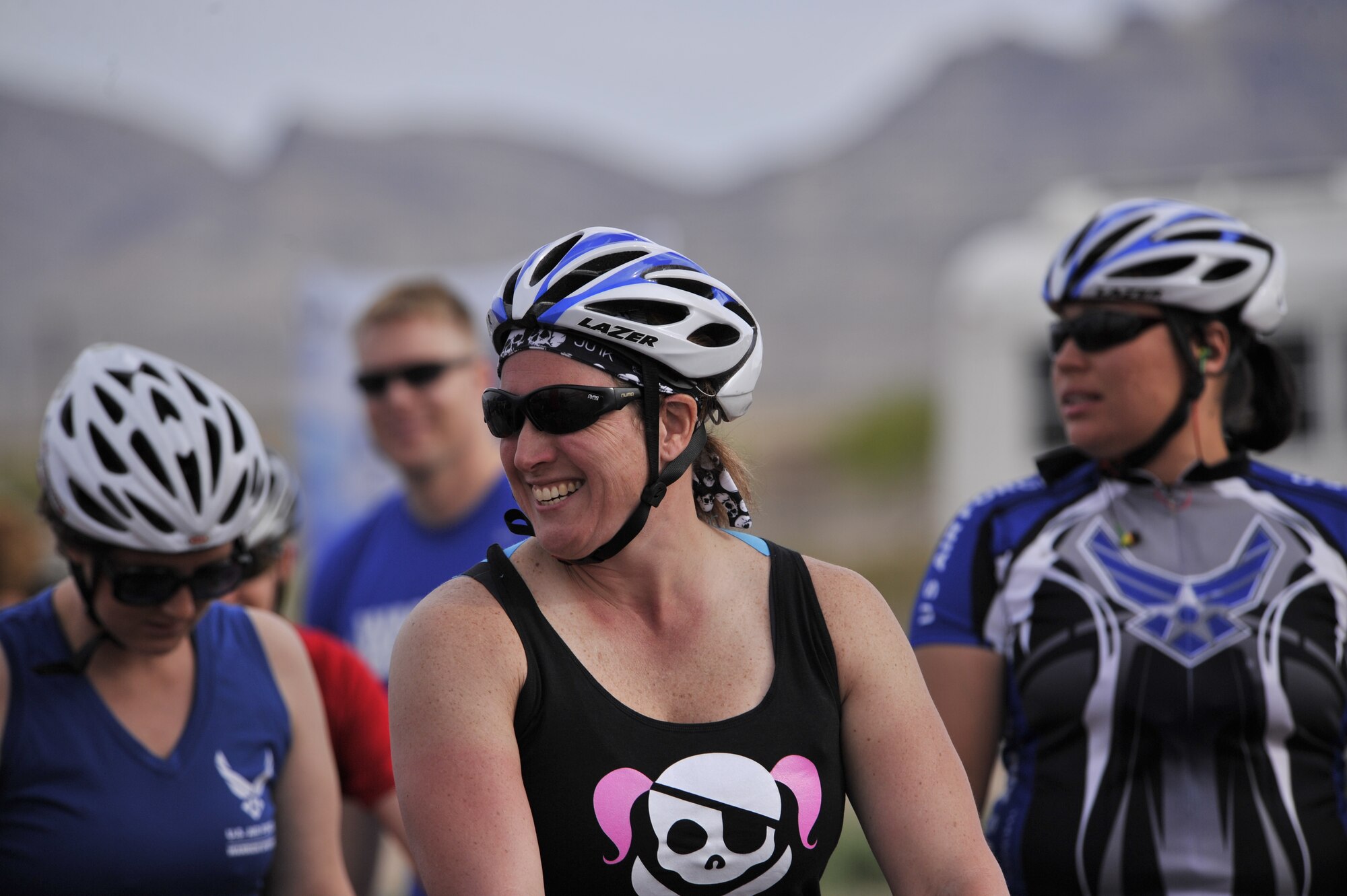 Shelby Hatch jokes with fellow participants before the start of the cycling competition during the 2014 Wounded Warrior Air Force Trials at Nellis Air Force Base, Las Vegas, Nev., April 9, 2014. Active duty and retired Airmen competed in swimming, basketball, volleyball, track and filed events, archery and shooting competitions.(U.S. Air Force photo by Airman 1st Class Christian Clausen)