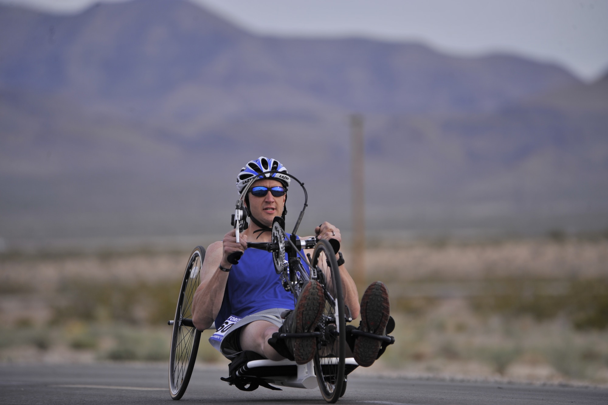 Jeremiah Means competes in the cycling competition during the 2014 Wounded Warrior Air Force Trials at Nellis Air Force Base, Las Vegas, Nev., April 9, 2014. Active duty and retired Airmen competed in swimming, basketball, volleyball, track and filed events, archery and shooting competitions.(U.S. Air Force photo by Airman 1st Class Christian Clausen)