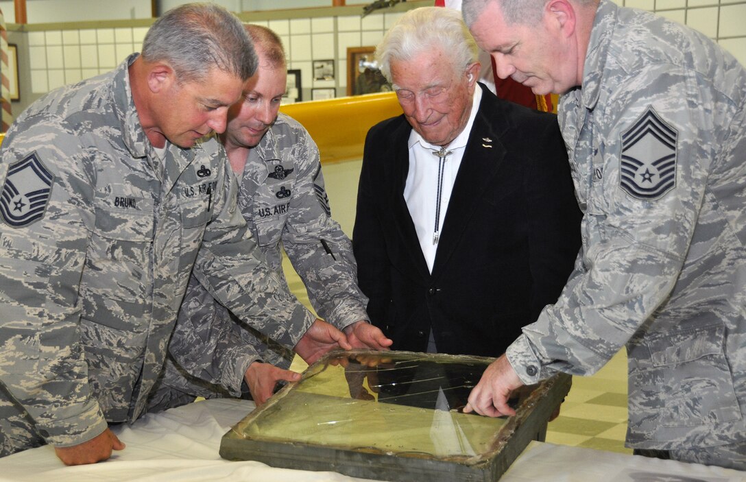 TRAVIS AIR FORCE BASE, Calif. -- Members of the 70th and 79th Air Refueling Squadrons presented Bruce Sooy with a B-25 windshield at the Travis Air Force Base Heritage Center, April 8, 2014. (U.S. Air Force photo/Staff Sgt. Cindy G. Alejandrez)