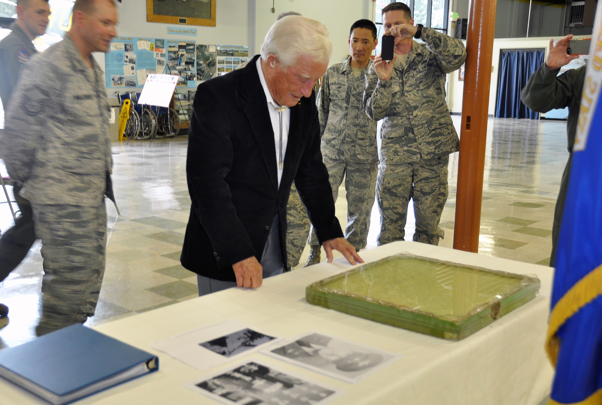 TRAVIS AIR FORCE BASE, Calif. -- Members of the 70th and 79th Air Refueling Squadrons presented Bruce Sooy with a B-25 windshield at the Travis Air Force Base Heritage Center, April 8, 2014. (U.S. Air Force photo/Staff Sgt. Cindy G. Alejandrez)