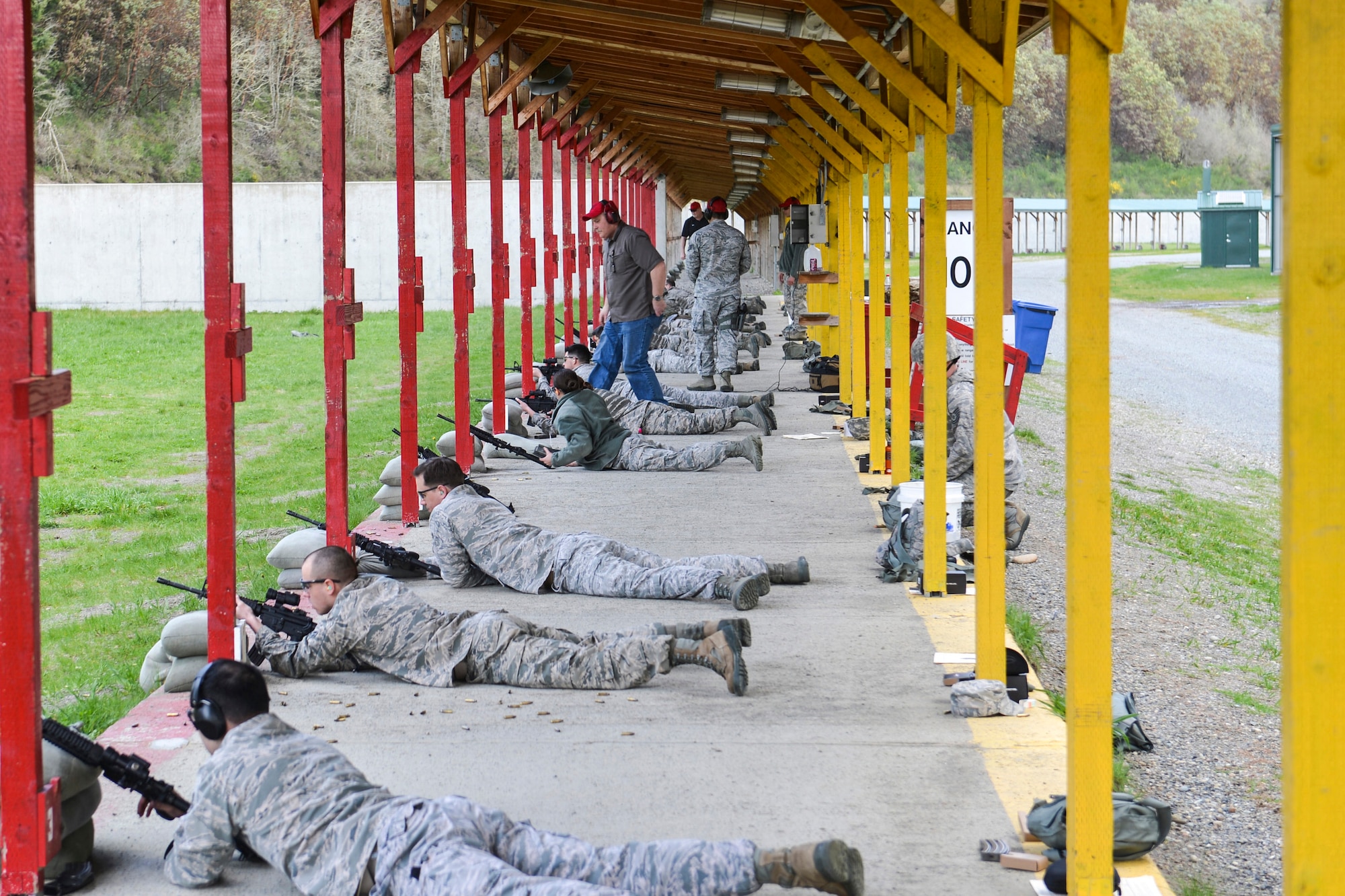 McChord Field Airmen prepare to shoot from the prone position at targets downrange in order to qualify on the M-4 carbine rifle at Range 108 next to North Fort Lewis, April 9, 2014 at Joint Base Lewis-McChord, Wash. Airmen must fire from the prone supported position, prone unsupported, kneeling with support and standing behind a barricade when they qualify on the M-4 carbine rifle. (U.S. Air Force photo/ Staff Sgt. Russ Jackson)