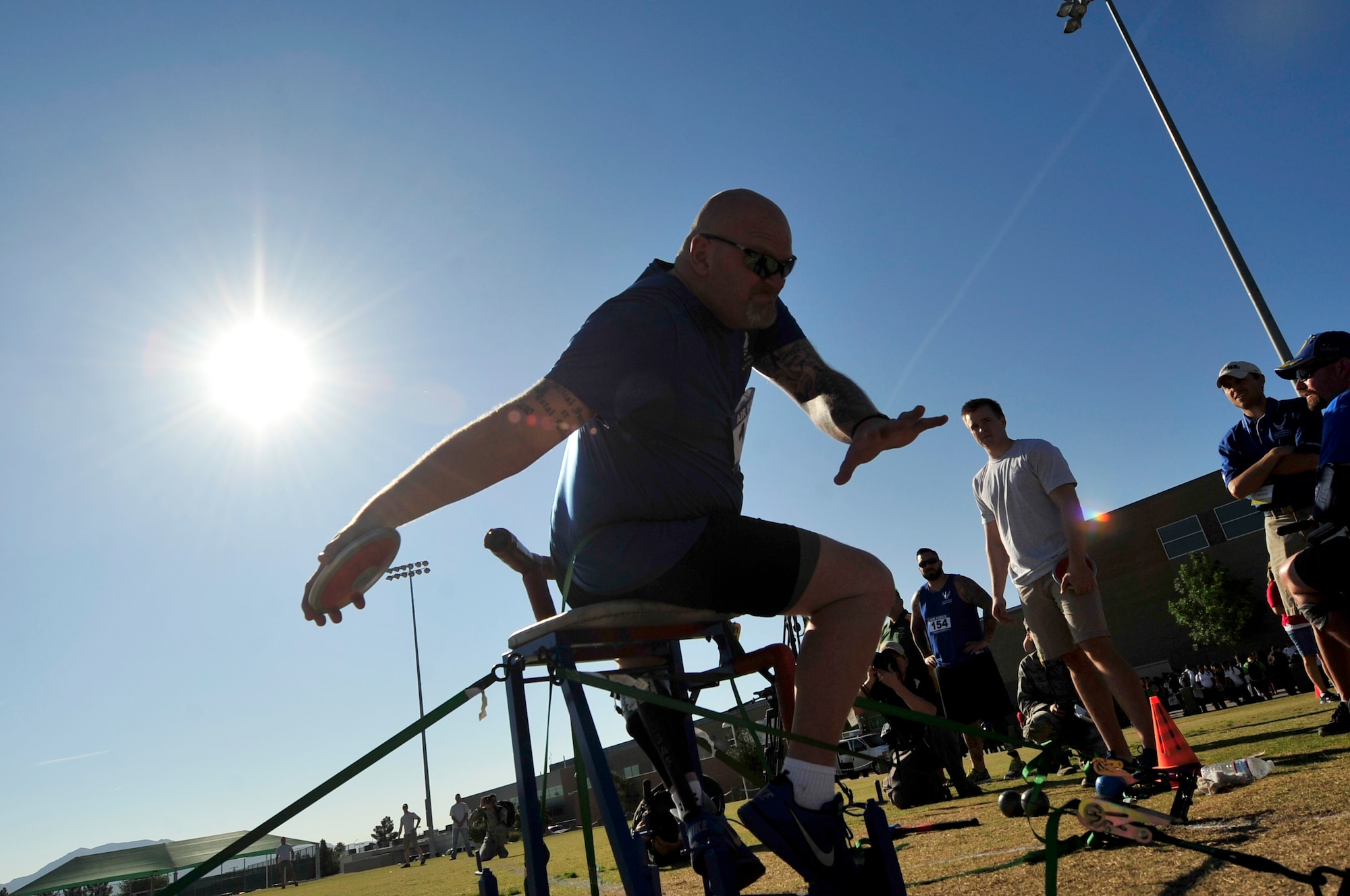 A wounded warrior performs the sitting shot at Rancho High School, Las Vegas, NV, April 8, 2014. During the trials wounded warriors competed in swimming, basketball, volleyball, track and field events, cycling, archery and shooting competitions. Palomino was hit by a mortar in Balad, Iraq which led to his medical discharge in 2005. (U.S. Air Force photo by Senior Master Sgt. Cecilio Ricardo)