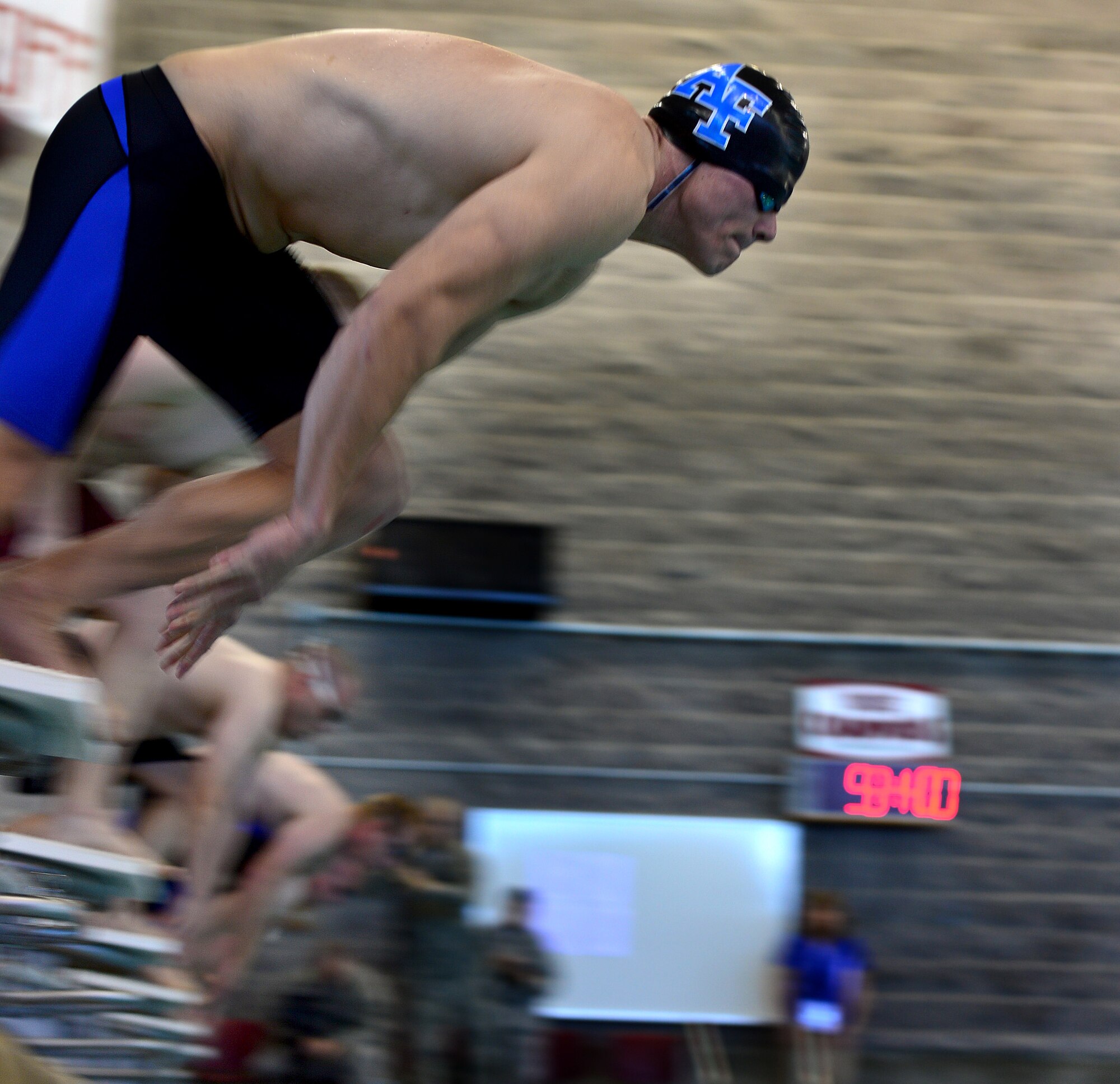 (Ret.) Staff Sgt. Tim Babb, prepares to dive during the men's 50-meter race at the Wounded Warrior Team Trials April 7, 2014.  During the trials wounded warriors competed in swimming, basketball, volleyball, track and filed events, cycling, archery and shooting competitions. (U.S. Air Force photo by Staff Sgt. Nadine Barclay)