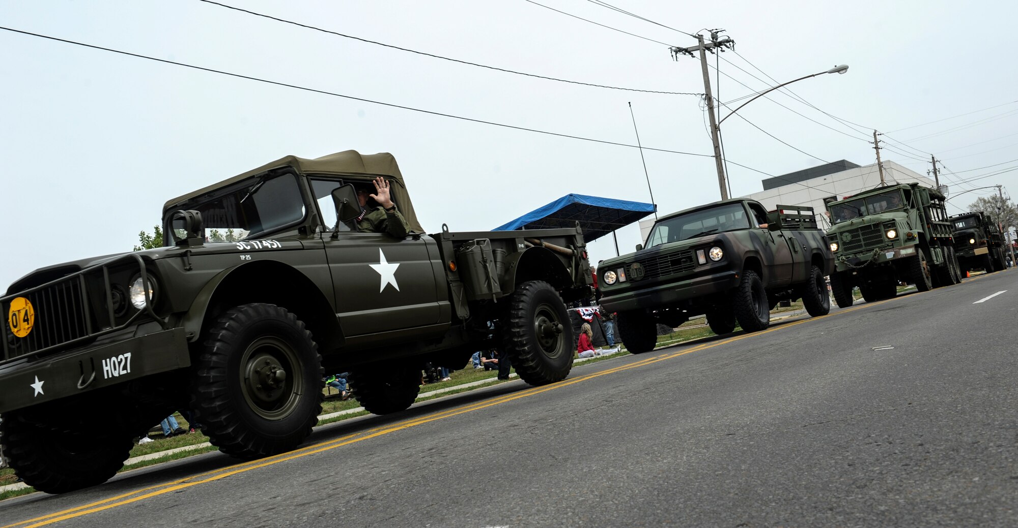 Vietnam era government vehicles drive down the parade route during the Welcome Home Vietnam Veterans Day parade April 5, 2014, in Jacksonville, Ark. The parade also featured Airmen and Marines from Little Rock Air Force Base. (U.S. Air Force photo by Staff Sgt. Jessica Condit)