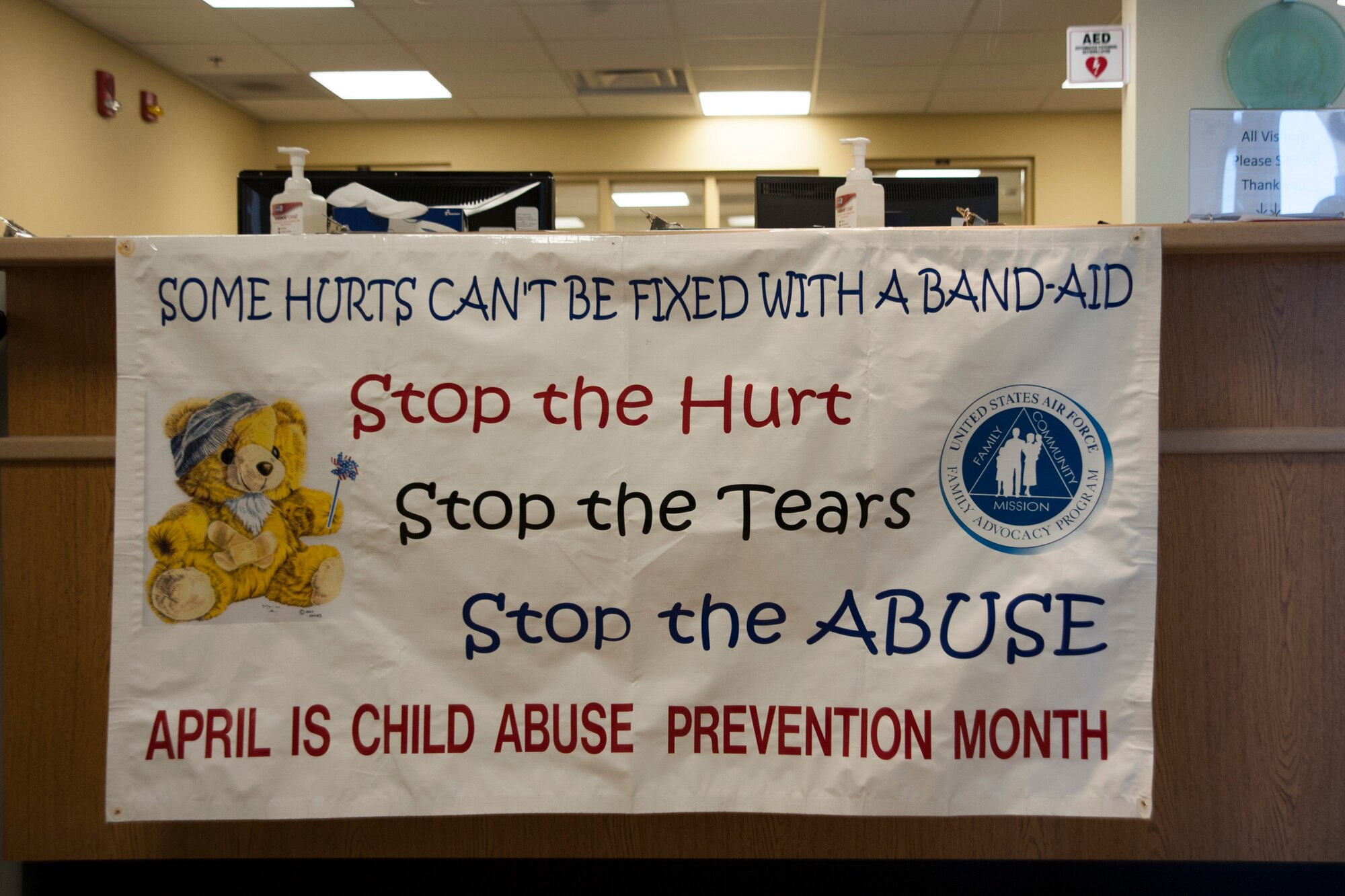 A sign for Child Abuse Prevention Month hangs at the reception desk of the Child Development Center, April 7, 2014, Vandenberg Air Force Base, Calif.  The CDC also had pinwheels displayed outside the building to raise awareness during the month of April. (U.S. Air Force photo/Airmen 1st Class Yvonne Morales) 