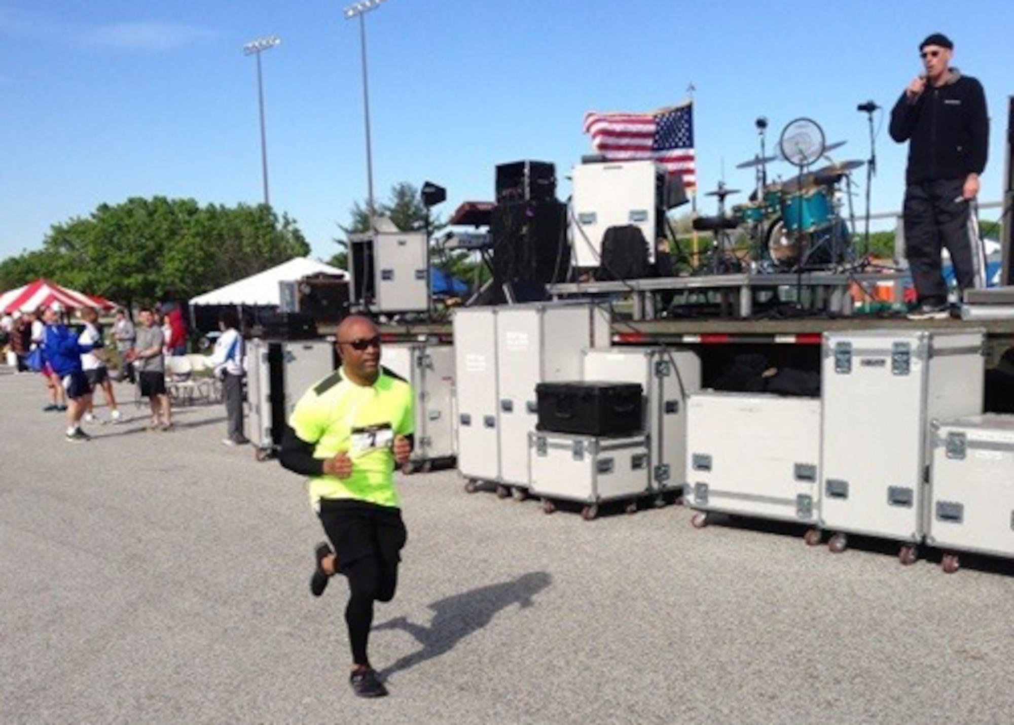 Chief Master Sgt. Will Sanders, 11th Wing command chief, approaches the finish line during Joint Base Andrews Inaugural Half Marathon here April 13, 2013. The Chief's Group hosted the event to promote unity between various units and services represented here. A half marathon is 13.1 miles.  (Courtesy Photo)