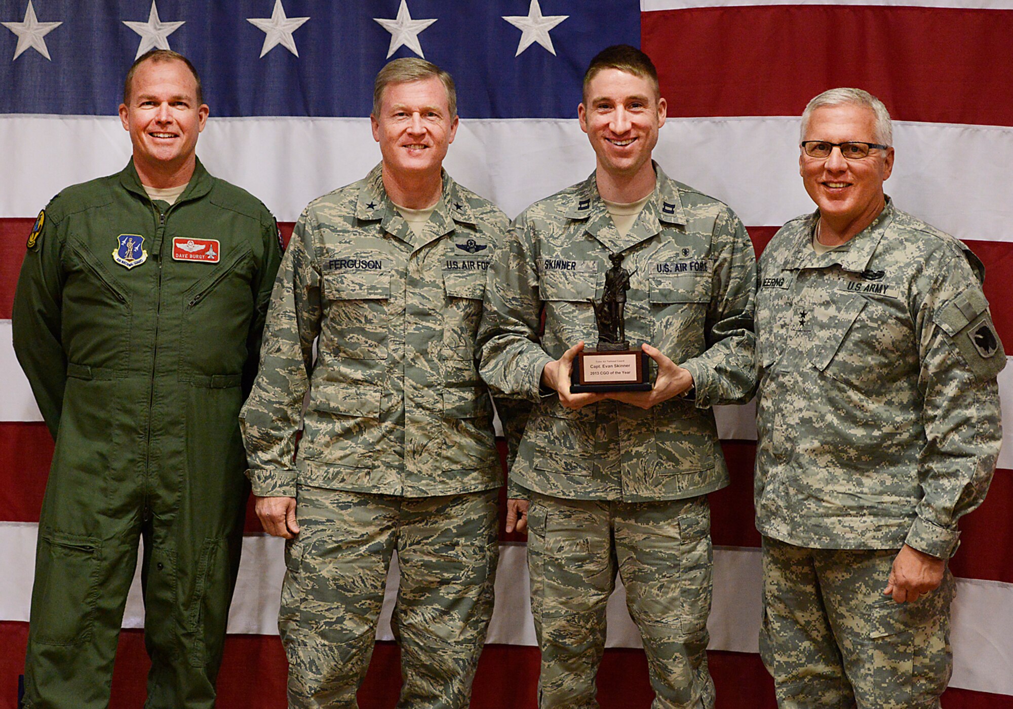 Oklahoma Adjutant General, Major General Myles Deering, along with Assistant Adjutant General Air, Brigadier General Gregory Ferguson and 138th Fighter Wing Commander, Colonel David Burgy, present Captain Evan Skinner with the Company Grade Officer of the Year award during a ceremony at the 138th Fighter Wing, Tulsa Air National Guard, April 6, 2014.  The luncheon and award ceremony was held to honor the 2013 Outstanding Airman of the Year for the 138th FW.   (U.S. National Guard photo by Master Sgt.  Mark A. Moore/Released)